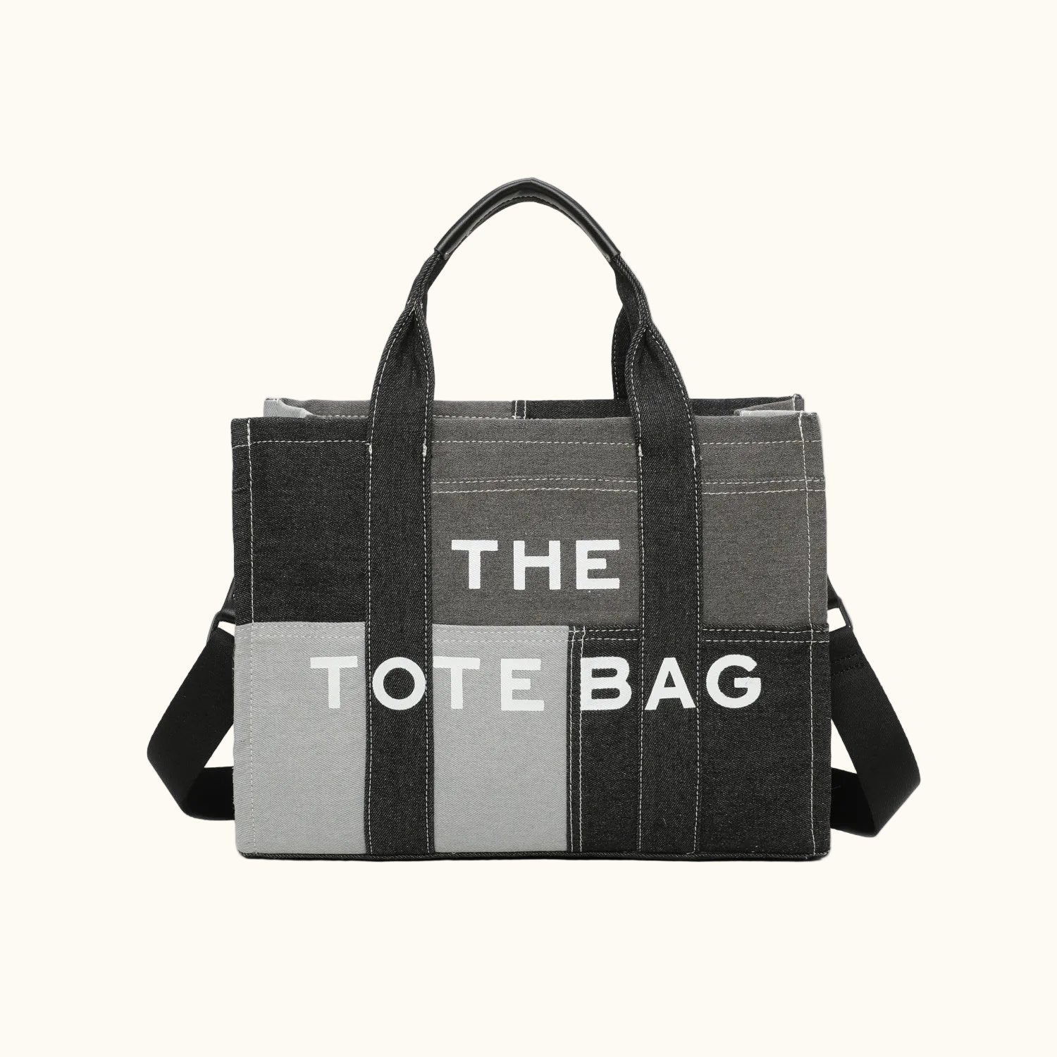 Gray tote bag with black handles and a visible brand name on a white background