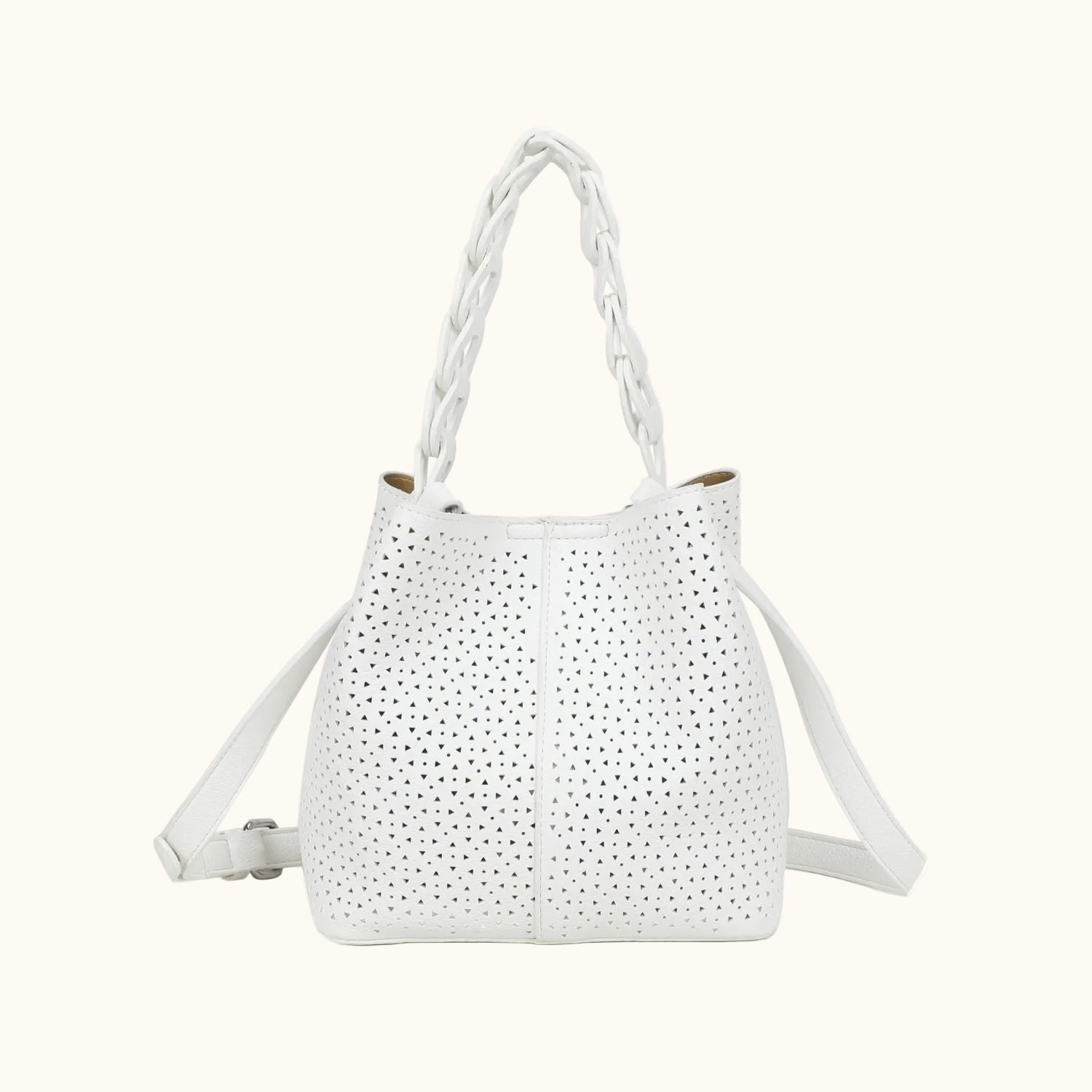 White handbag with perforated design on a white background