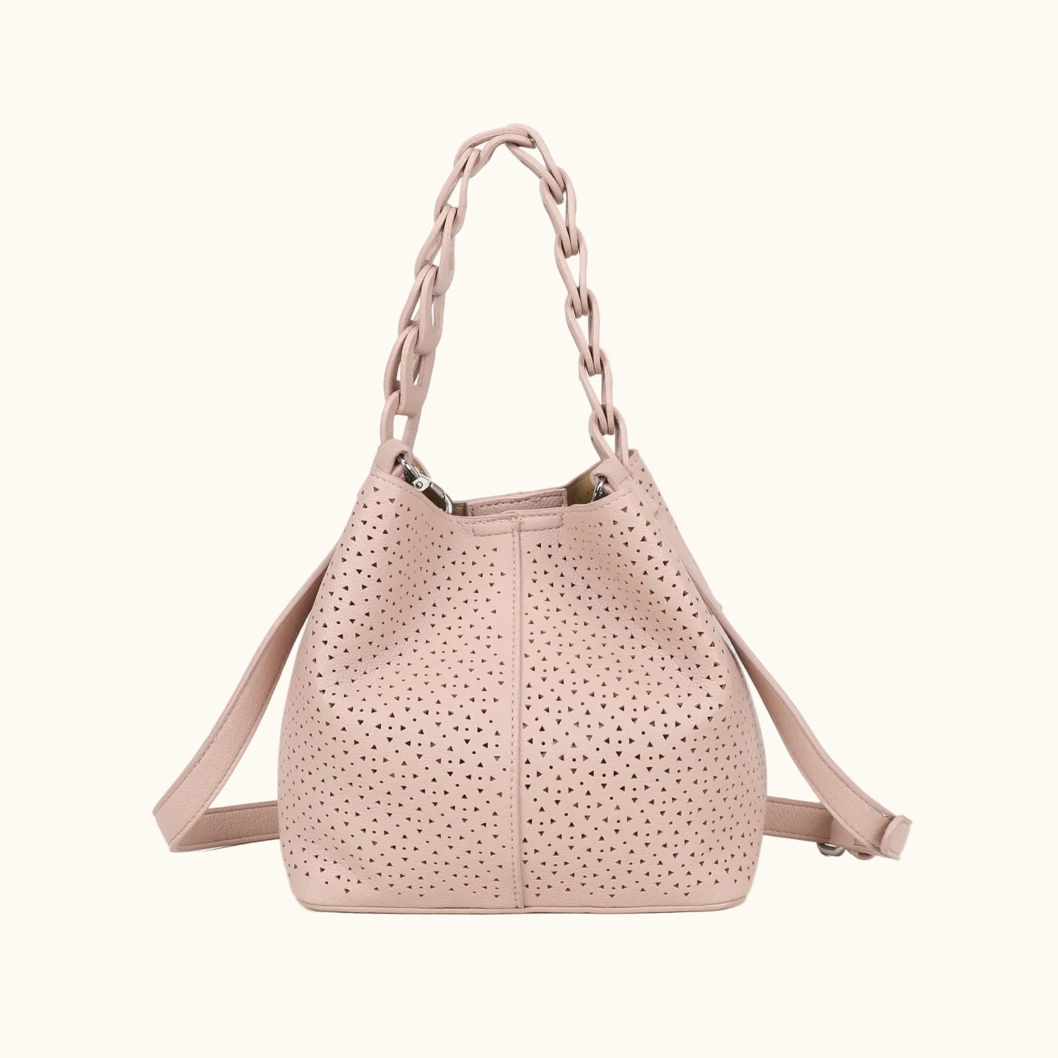 Pink handbag with perforated design on a white background
