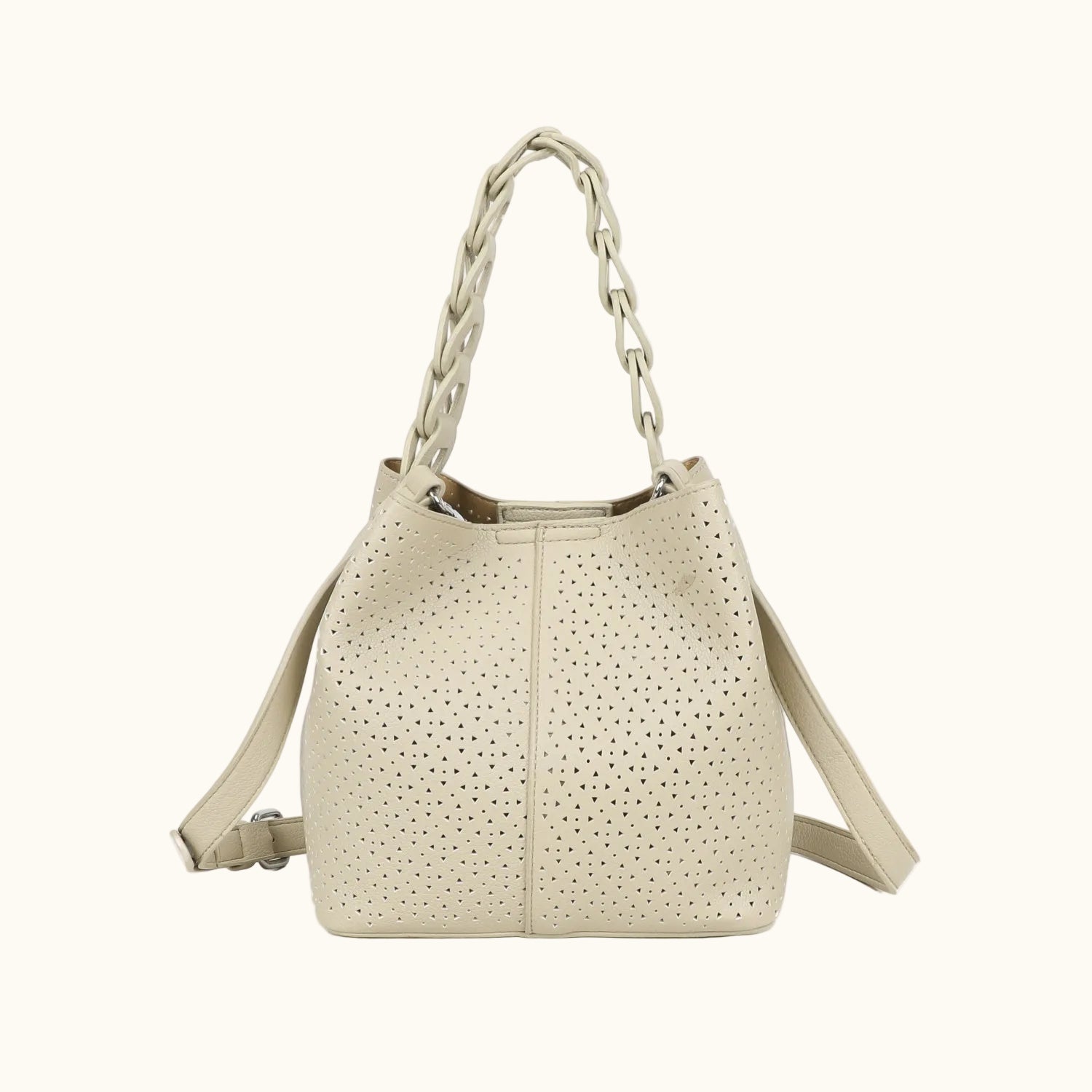 Beige handbag with perforated design on a white background