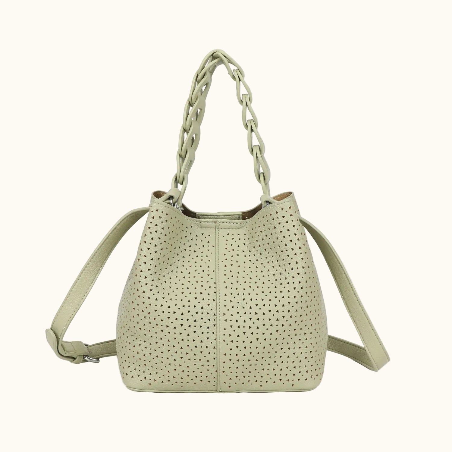 Light green handbag with perforated design on a white background