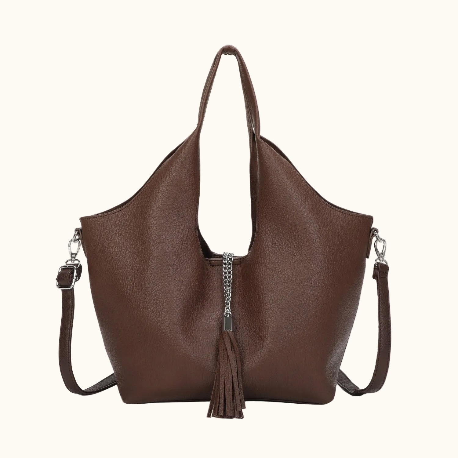 Brown leather handbag with a tassel on a white background