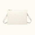 White handbag with a strap on a white background
