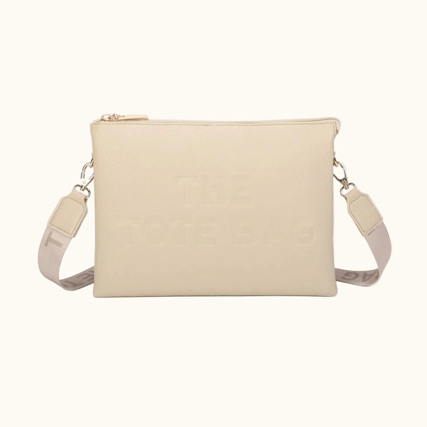 Beige crossbody bag with a strap on a white background