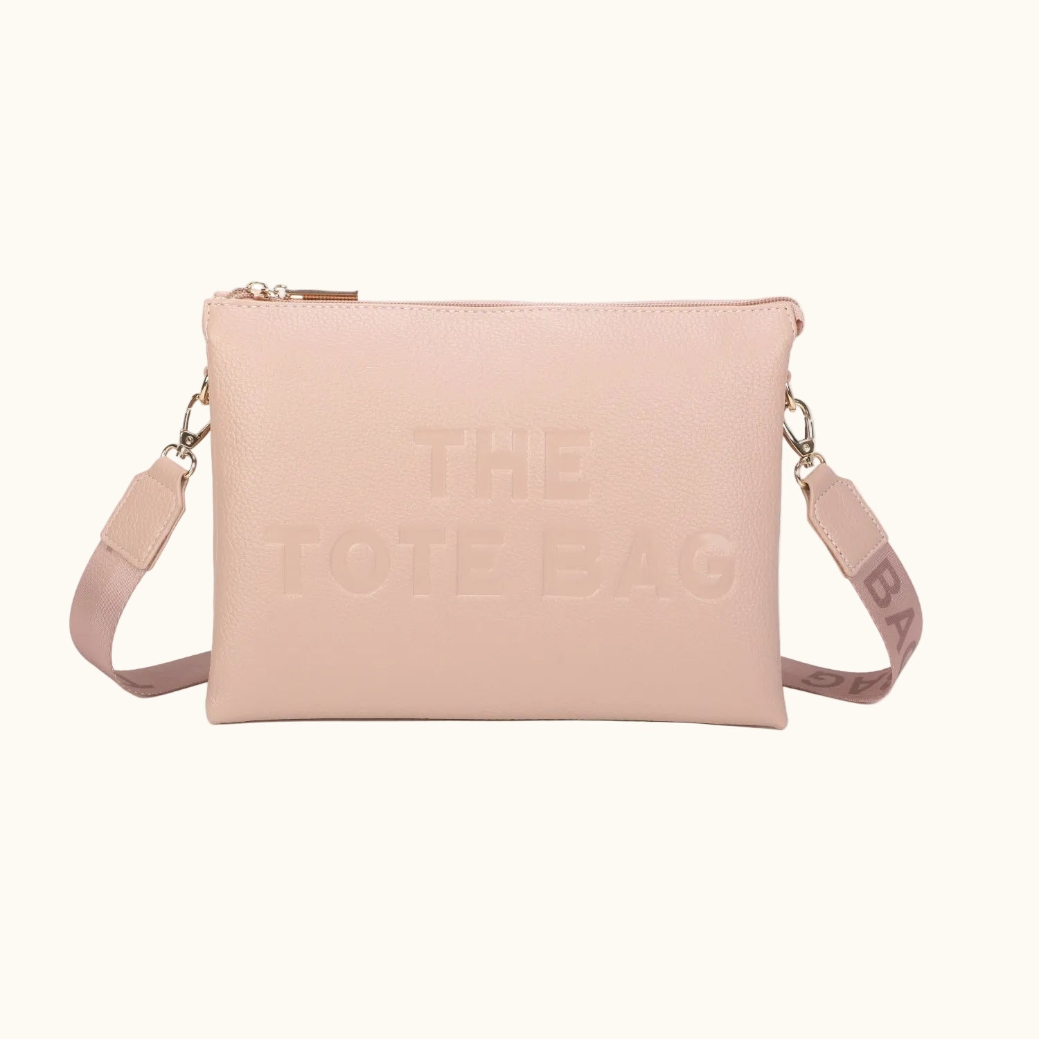 Pink tote bag with 'THE TOTE BAG' text on a white background