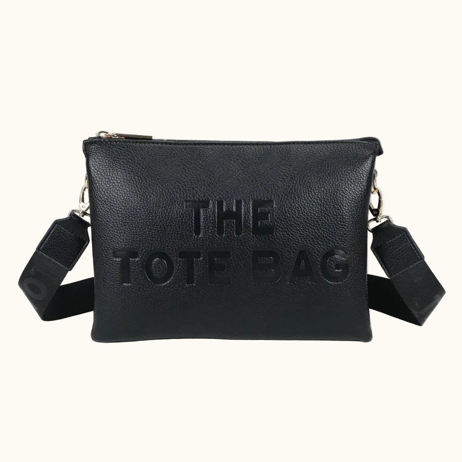 Black tote bag with 'THE TOTE BAG' text on a white background