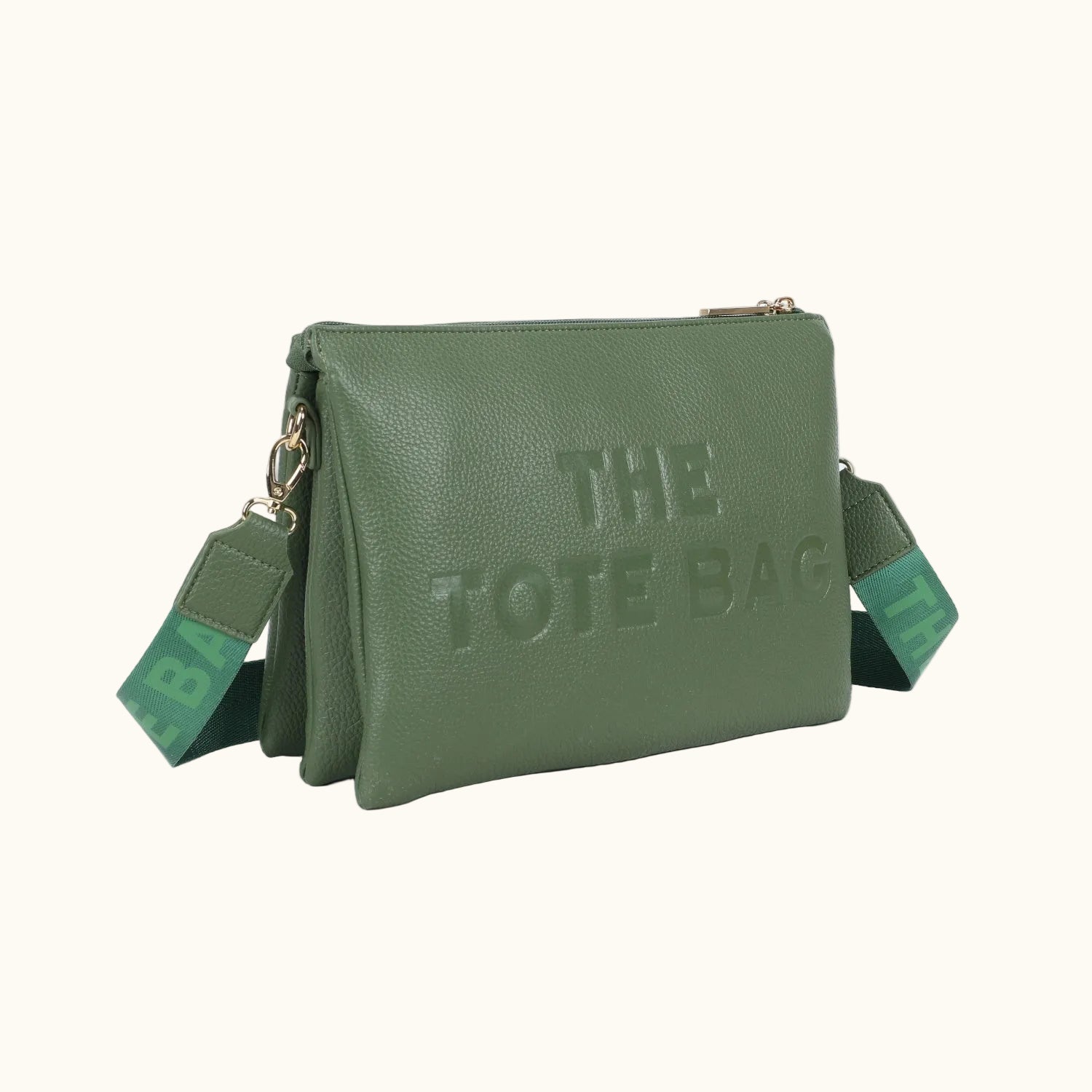 Green tote bag with 'THE TOTE BAG' text on a white background