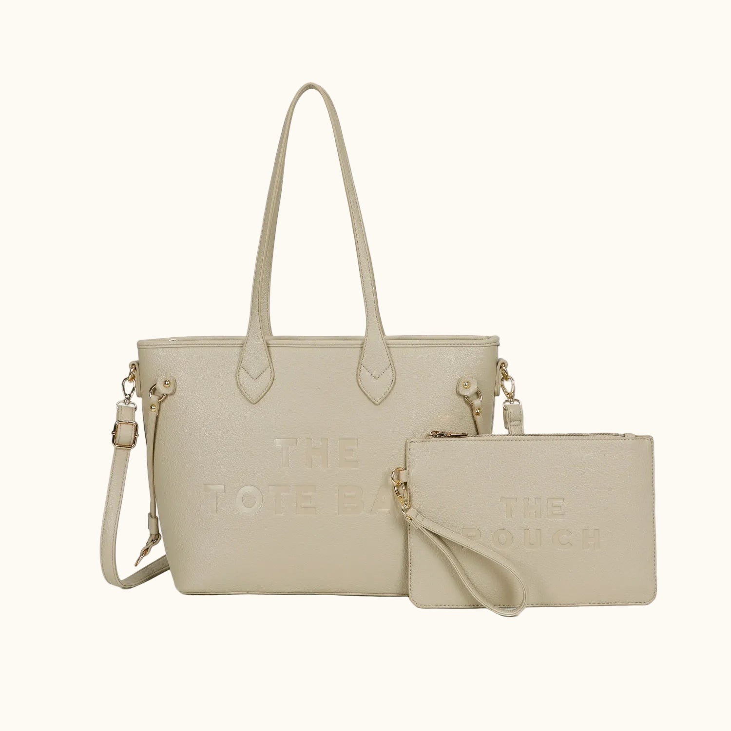 Beige handbag and matching pouch with 'The Coach' branding on a white background