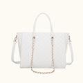 White handbag with gold chain detail on a white background