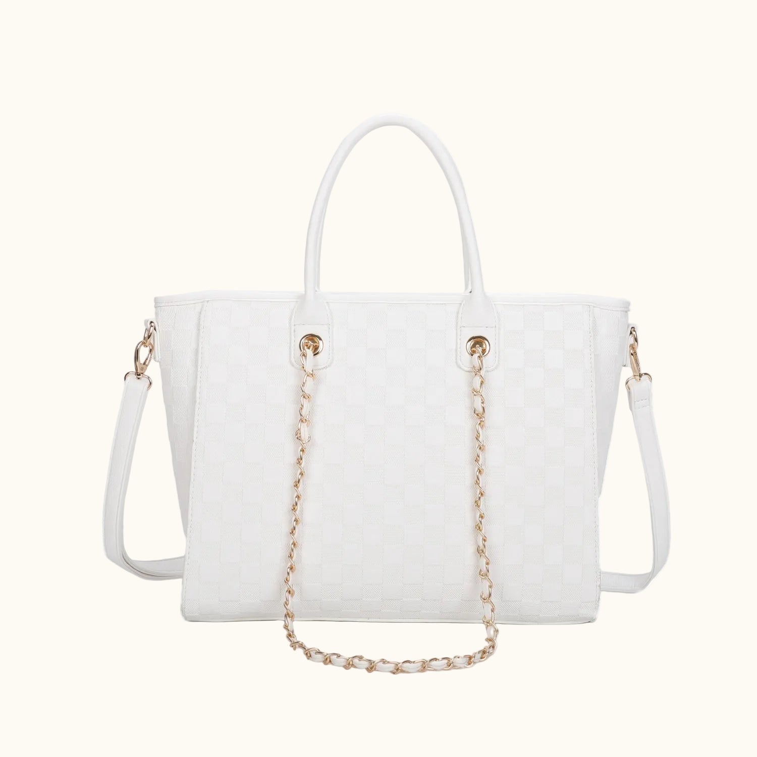 White handbag with gold chain detail on a white background