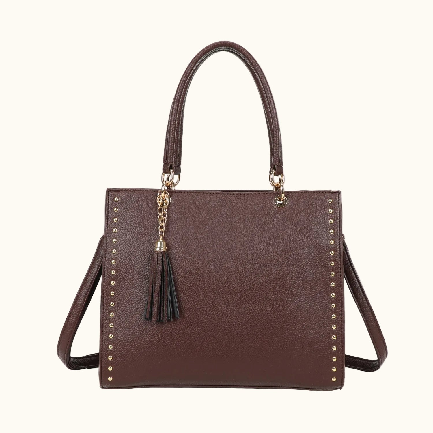 Brown handbag with studded details and a tassel on a white background