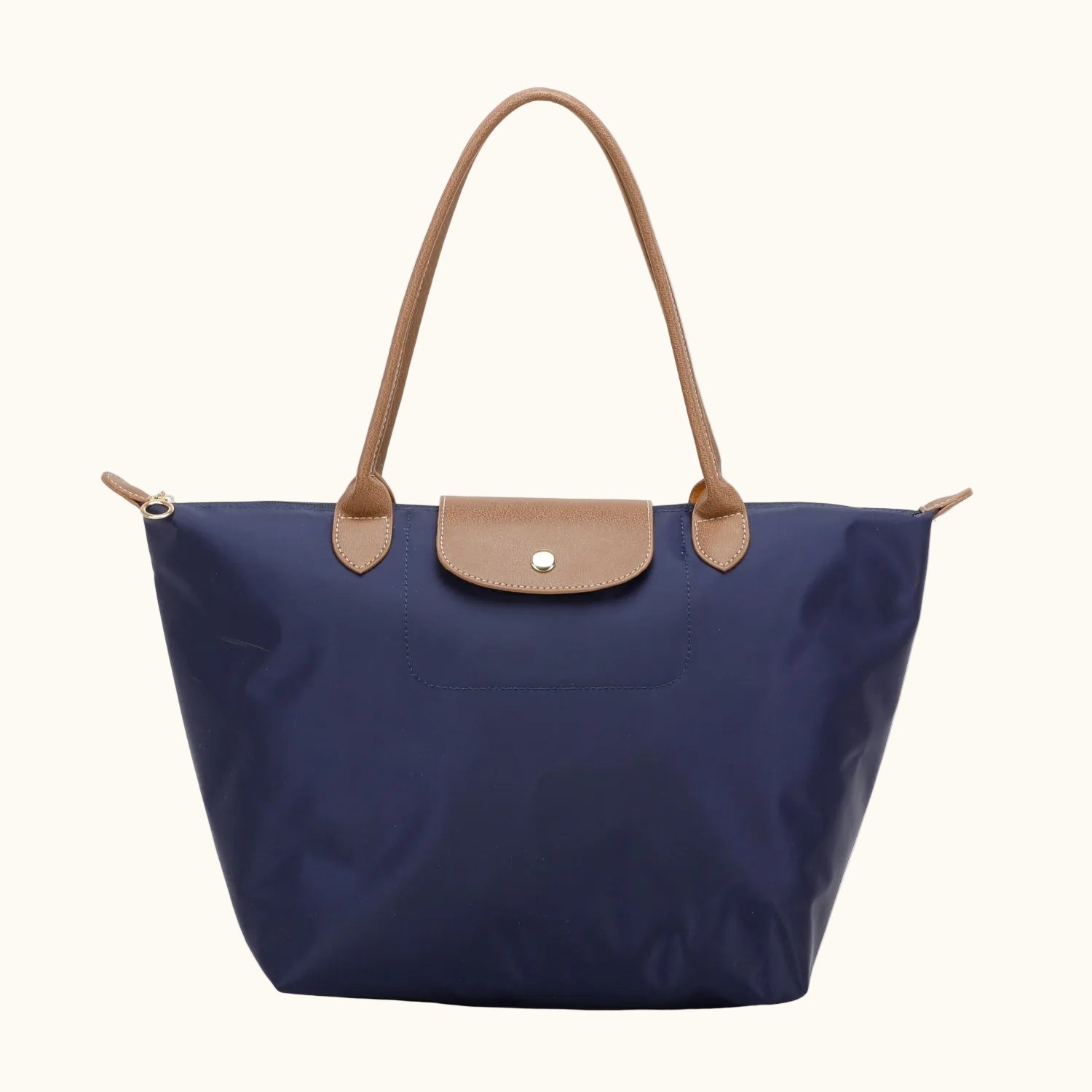 Navy blue handbag with brown leather accents on a white background