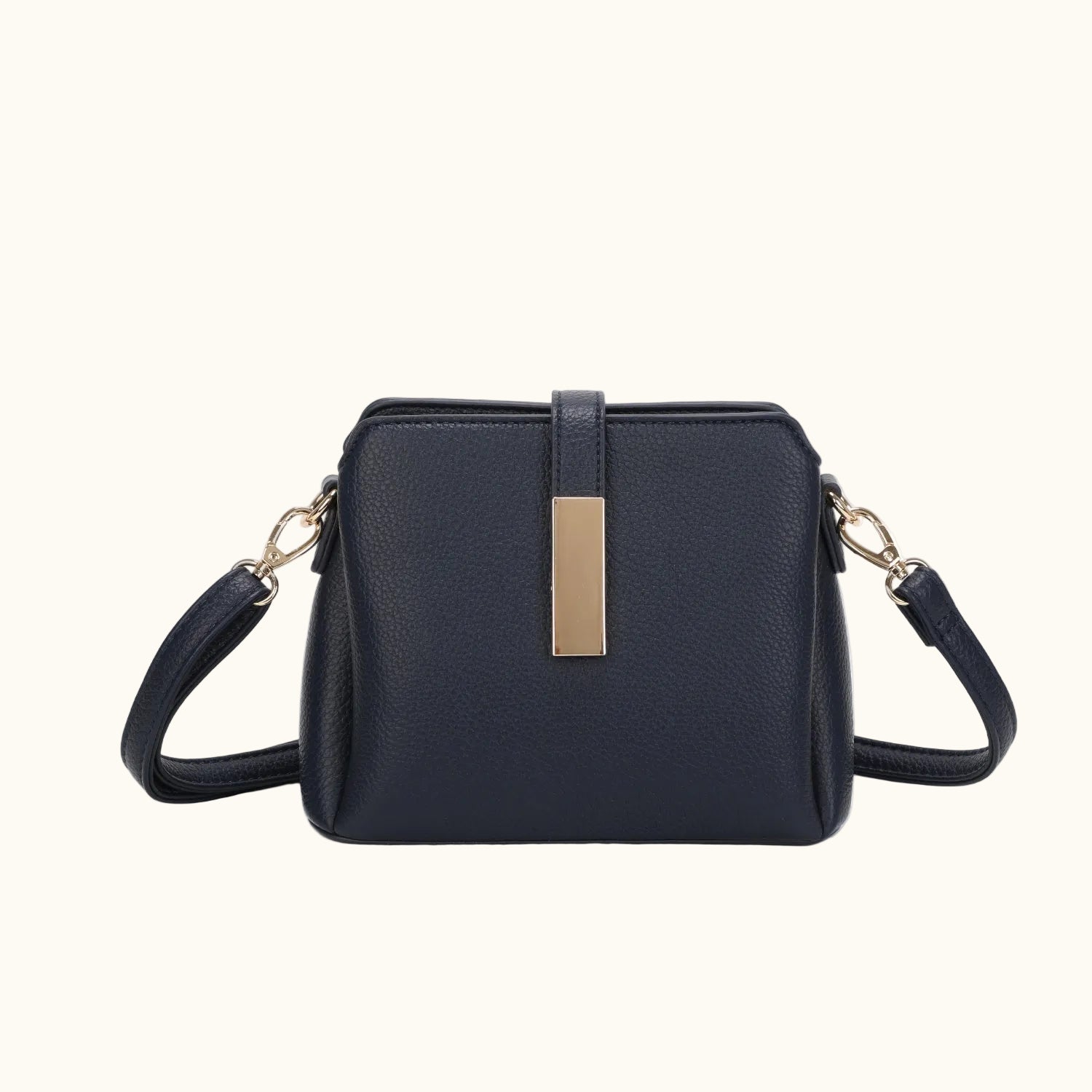 Navy blue handbag with a gold clasp on a white background