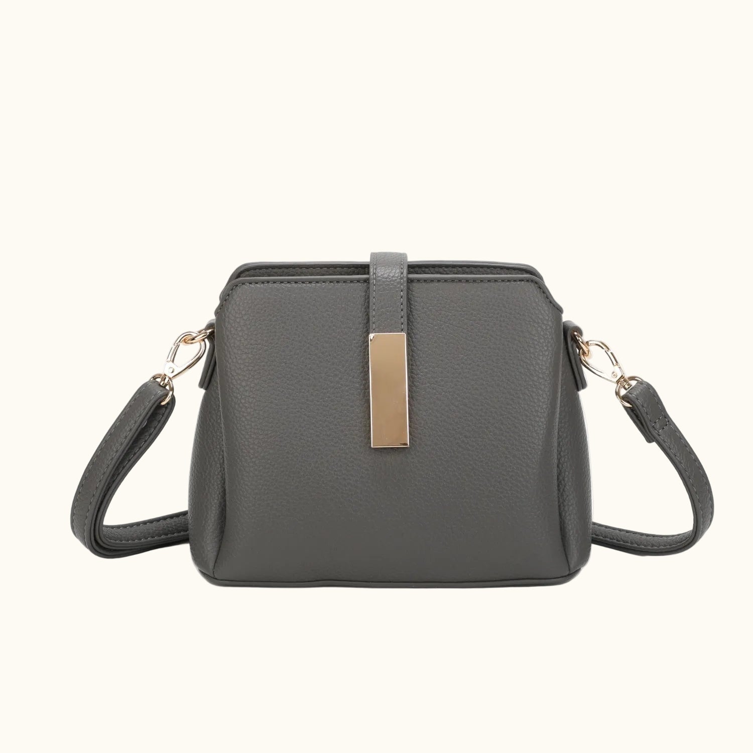 Gray handbag with a gold accent on a white background