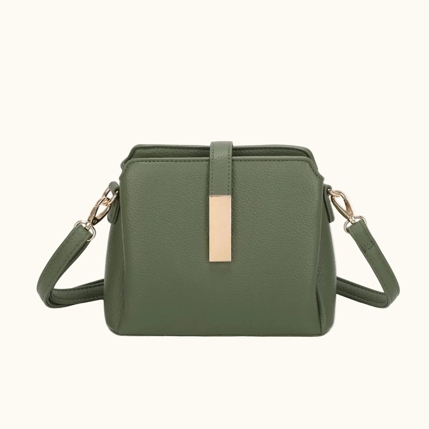 Green handbag with a gold accent on a white background
