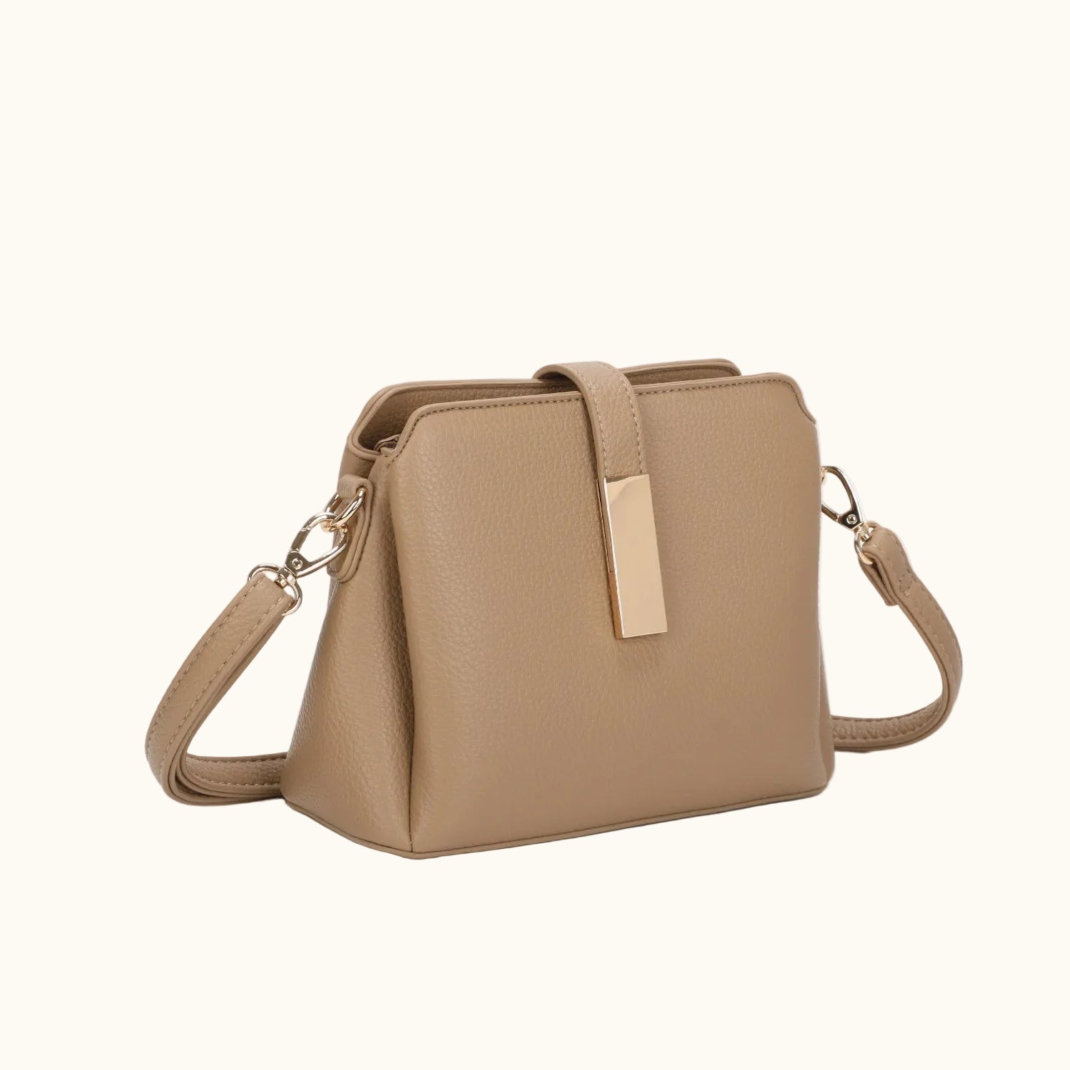 Beige handbag with a strap on a white background