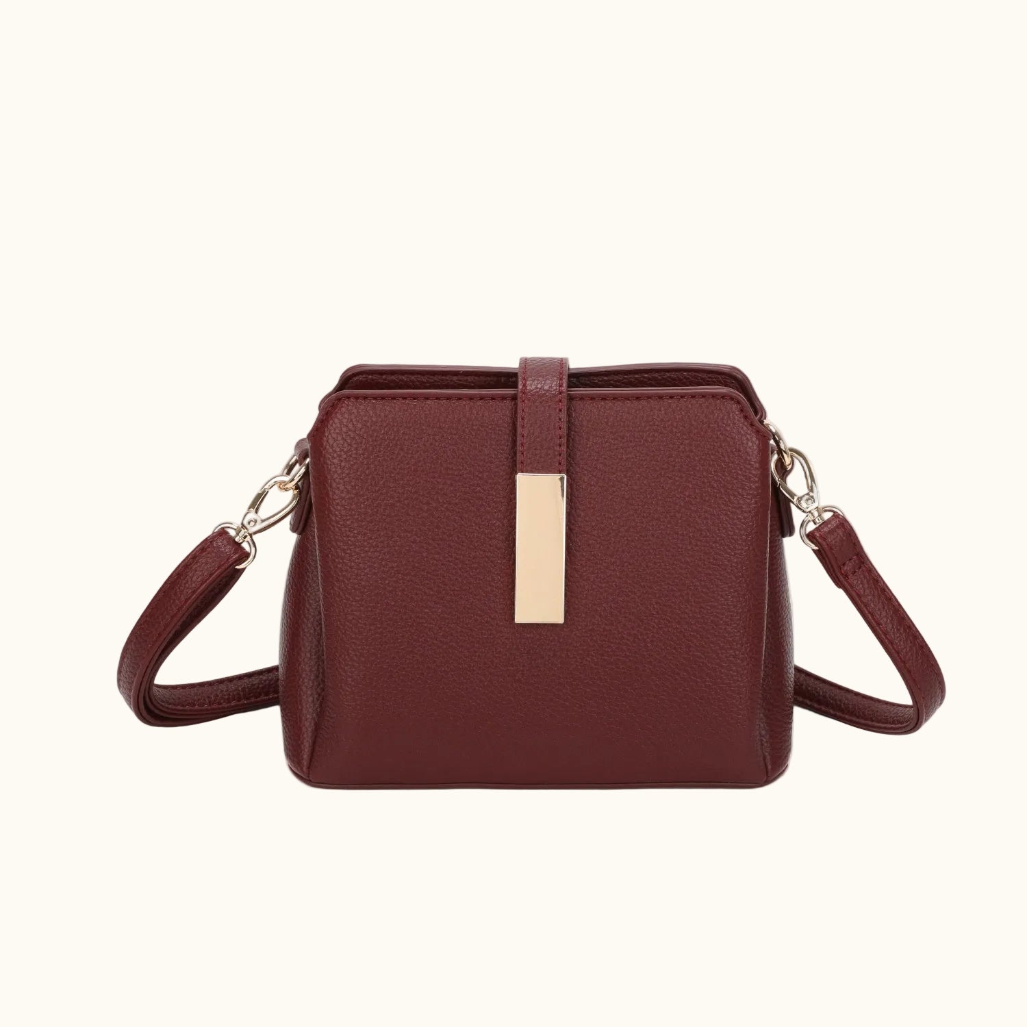 Brown handbag with a gold clasp on a white background