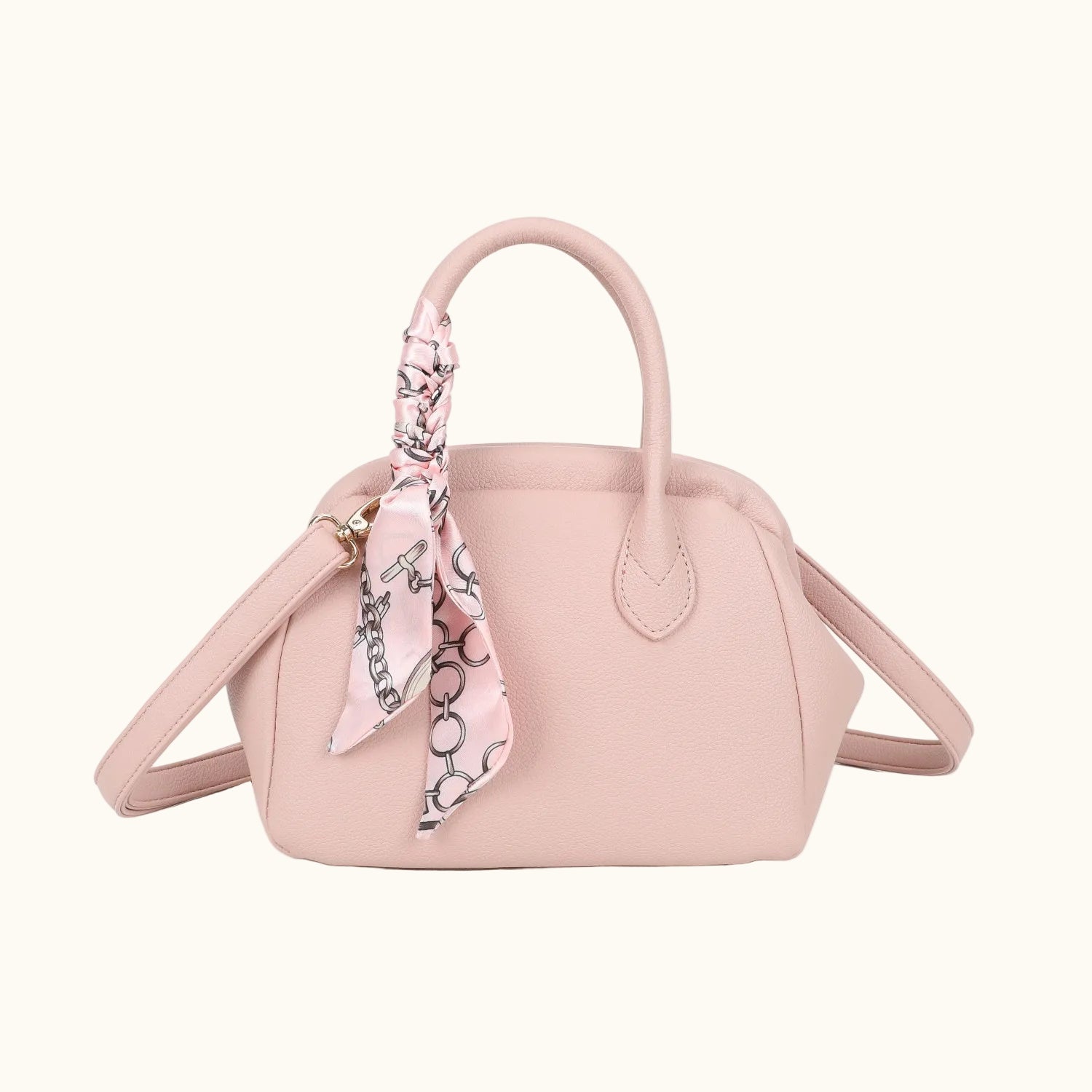 Pink handbag with a matching scarf on a white background
