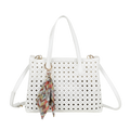 White perforated handbag with a decorative keychain on a white background
