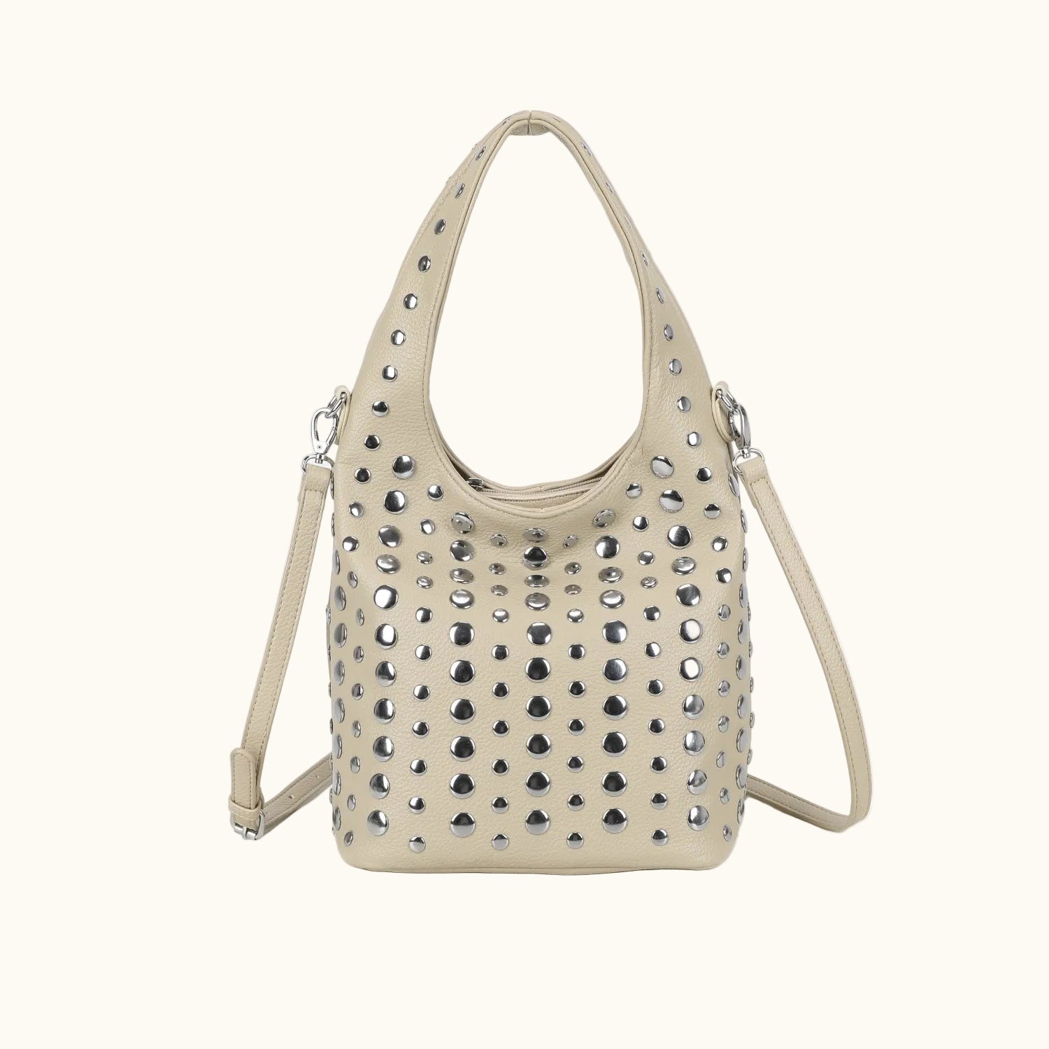Beige handbag with rhinestone embellishments on a white background