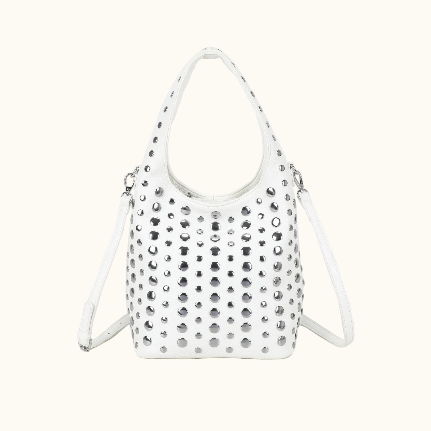 White handbag with silver studs on a white background