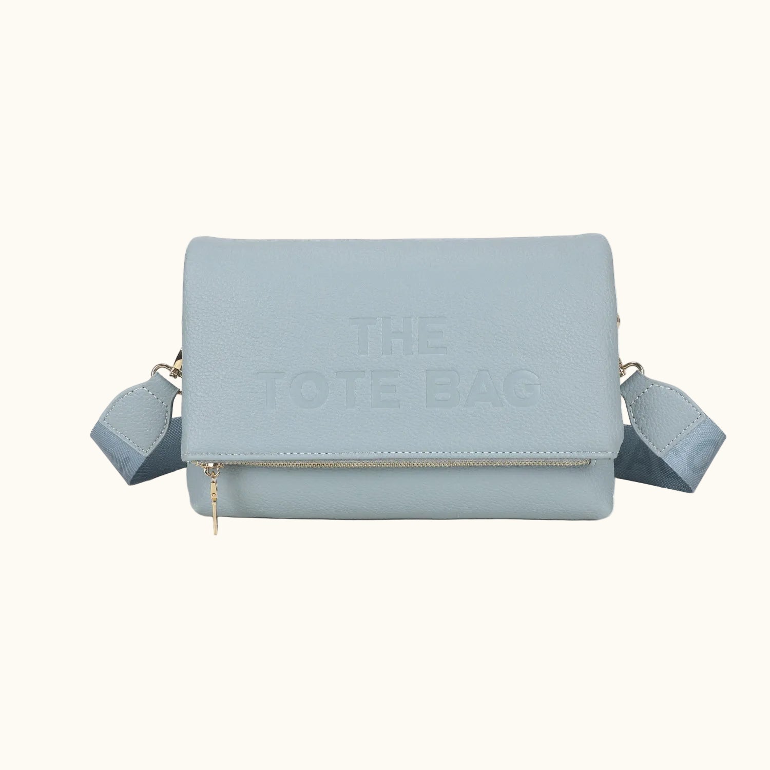 Light blue handbag with 'The Cote Bag' embossed on a white background