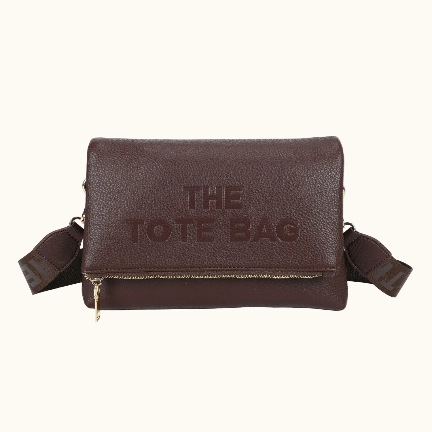 Brown leather tote bag with 'THE TOTE BAG' text on a white background