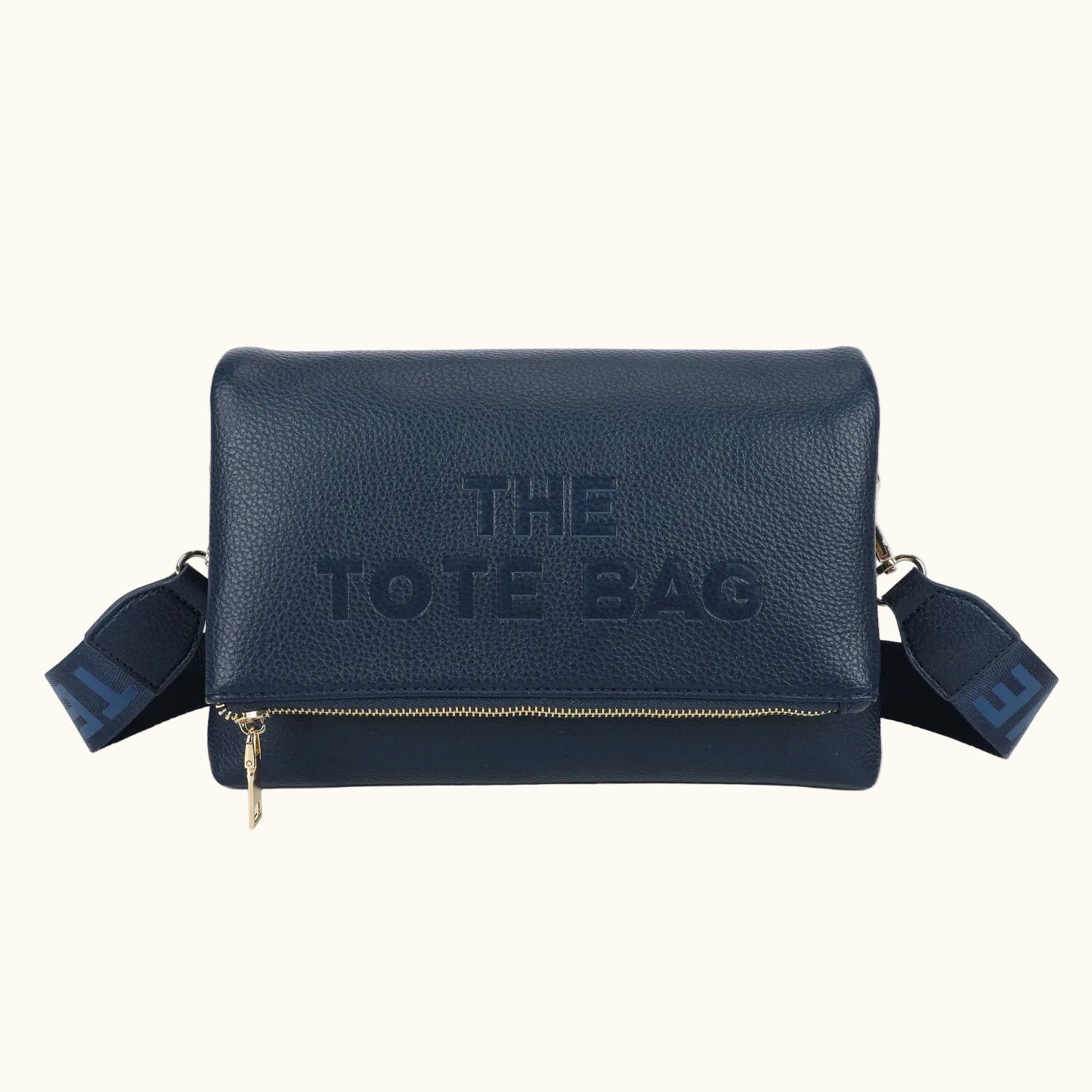 Navy blue tote bag with 'THE TOTE BAG' text on a white background