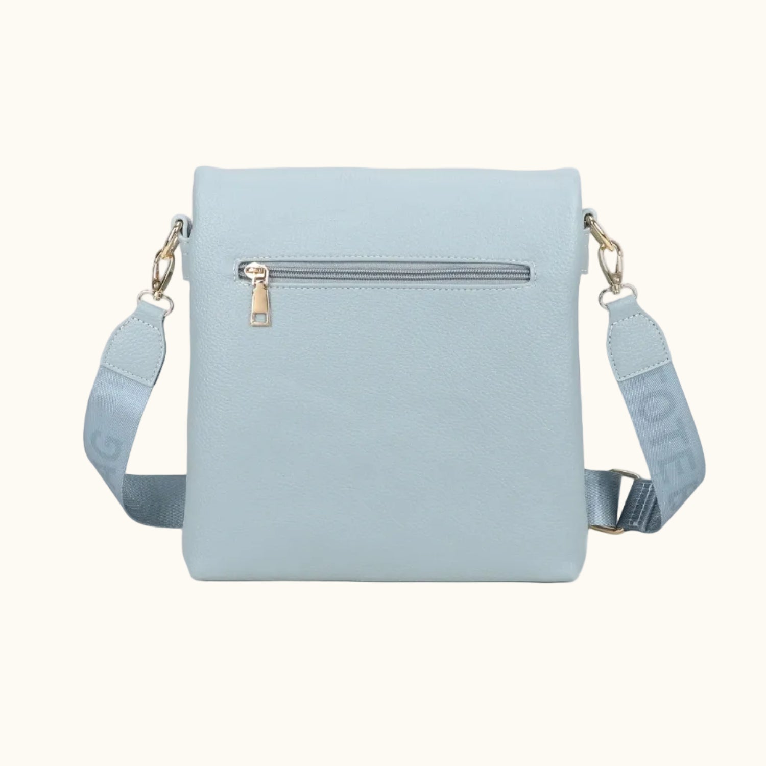 Light blue crossbody bag with a strap on a white background
