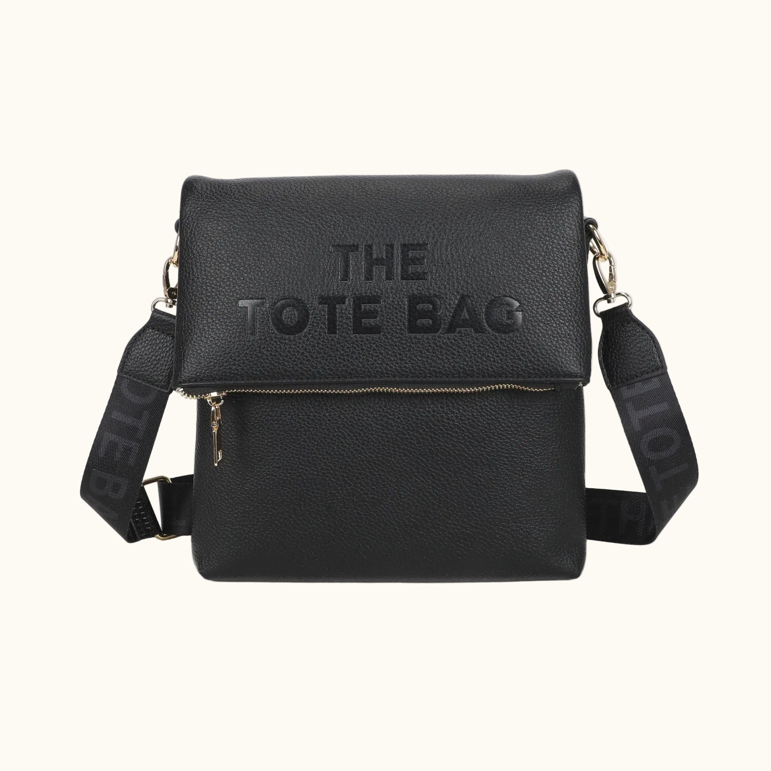 Black tote bag with 'THE TOTE BAG' text on a white background