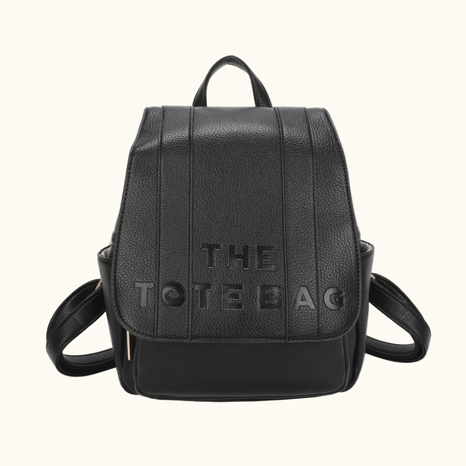 Black backpack with 'THE TOTE BAG' text on a white background