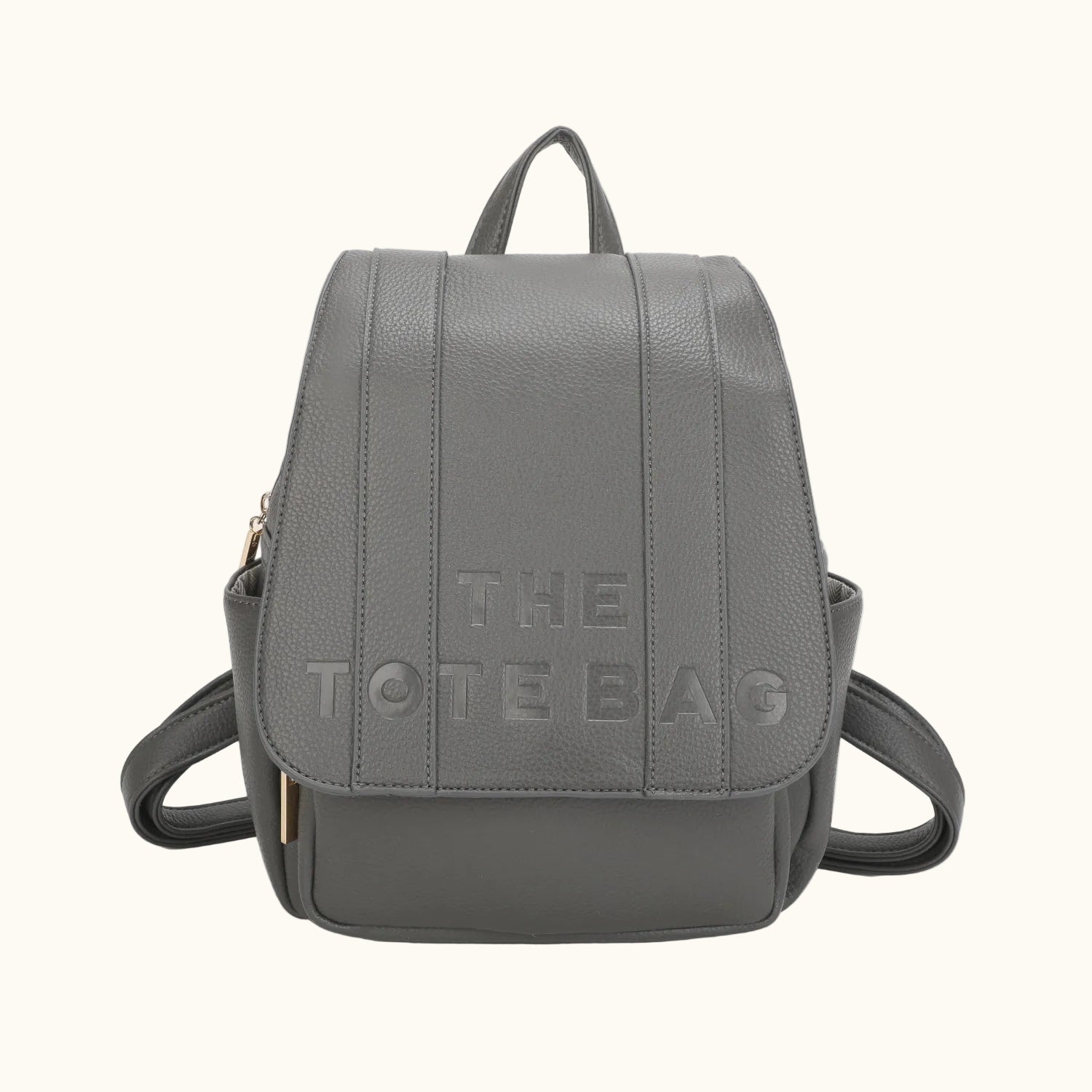 Gray backpack with 'THE TOTE BAG' text on a white background