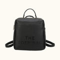 Black backpack with 'THE TOTE BAG' text on a white background