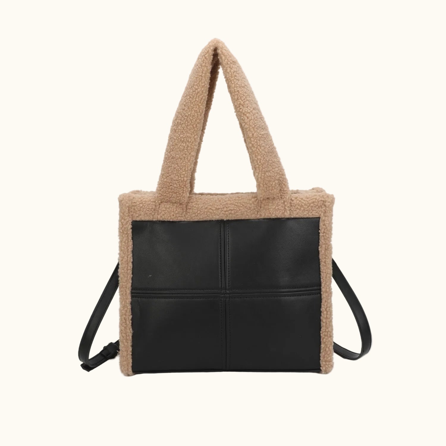 Tote bag with black leather section and beige textured exterior on a white background