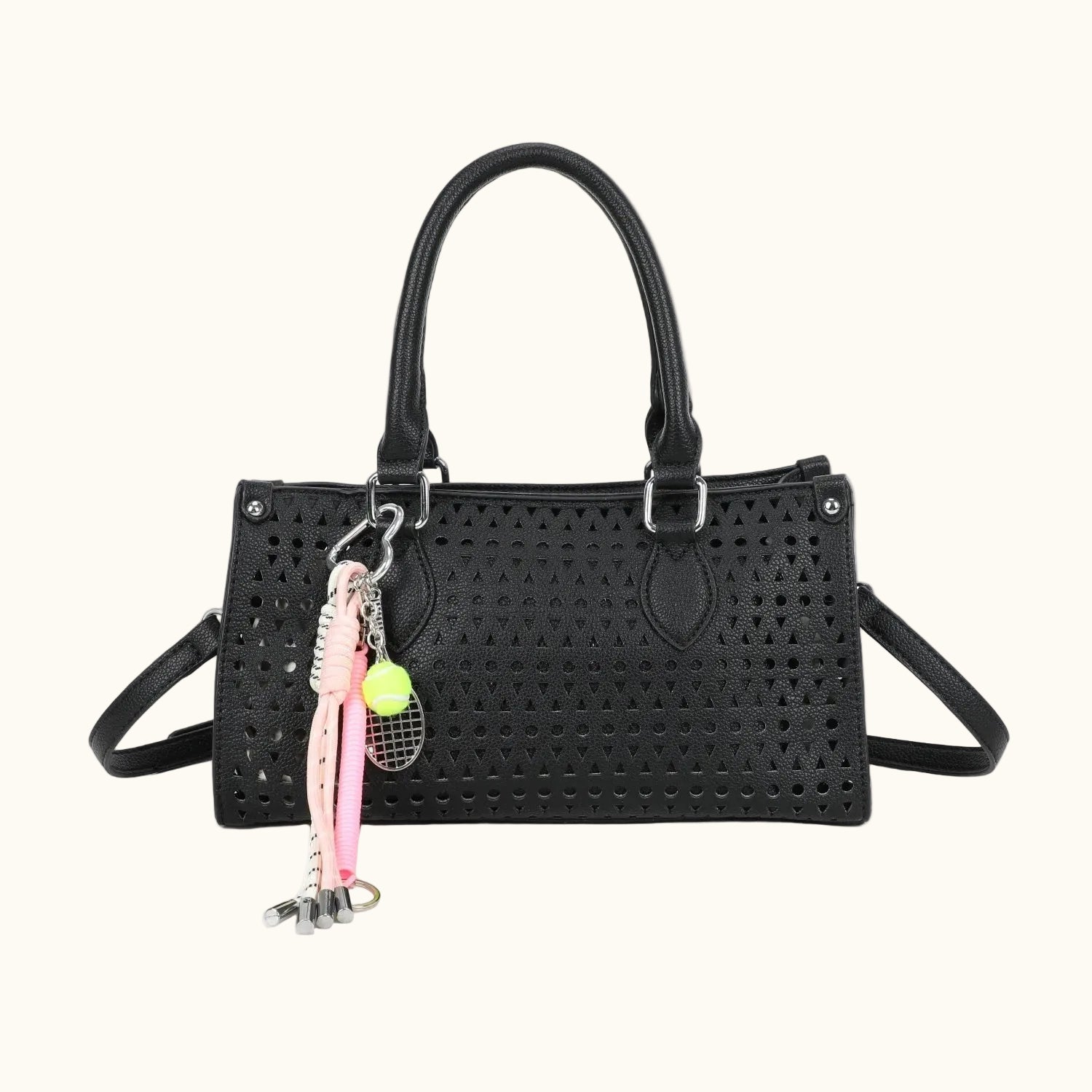 Black handbag with a pink keychain featuring a character on a white background