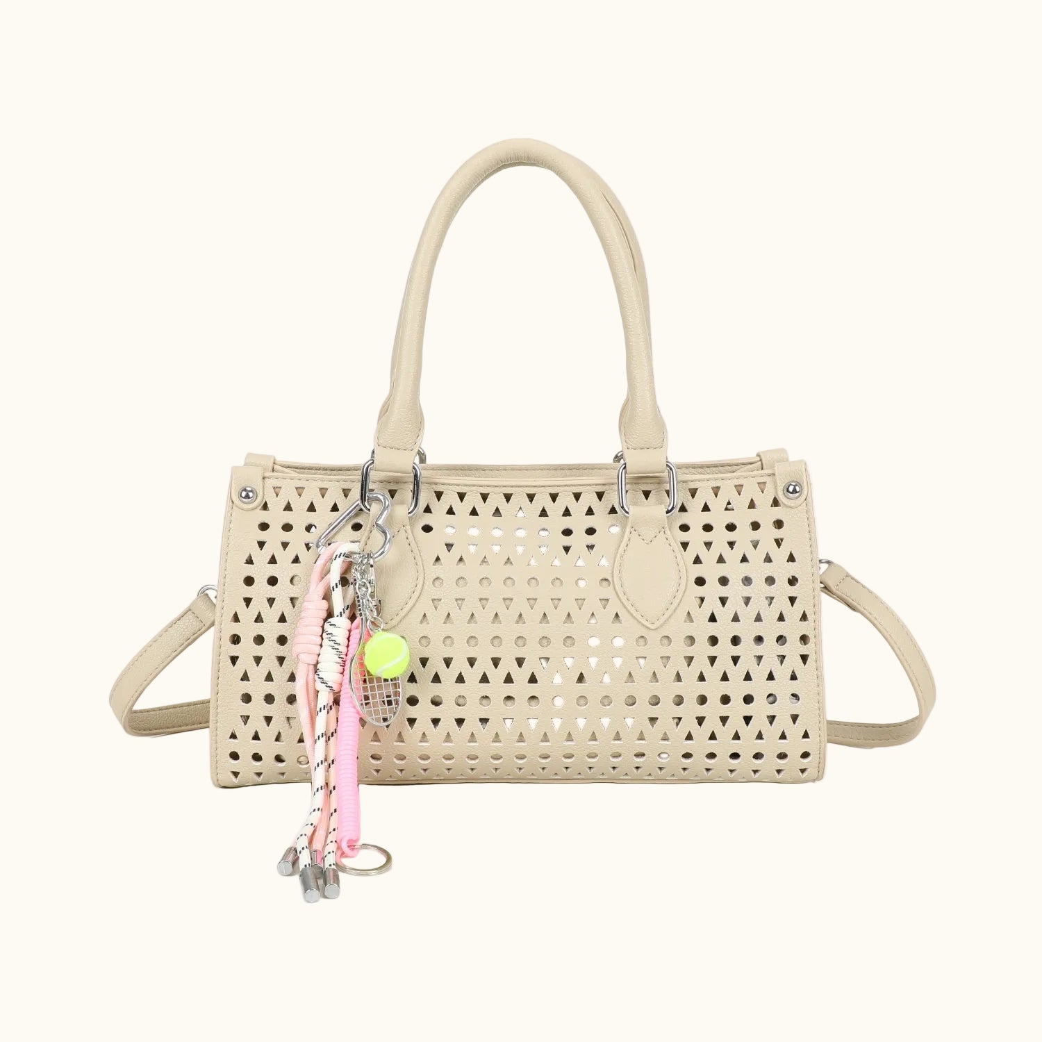 Beige handbag with a keychain on a white background