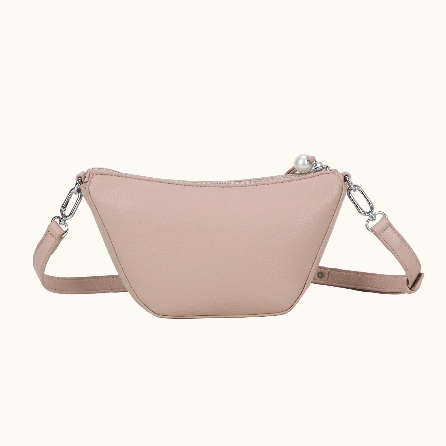 Beige crossbody bag with chain details on a white background