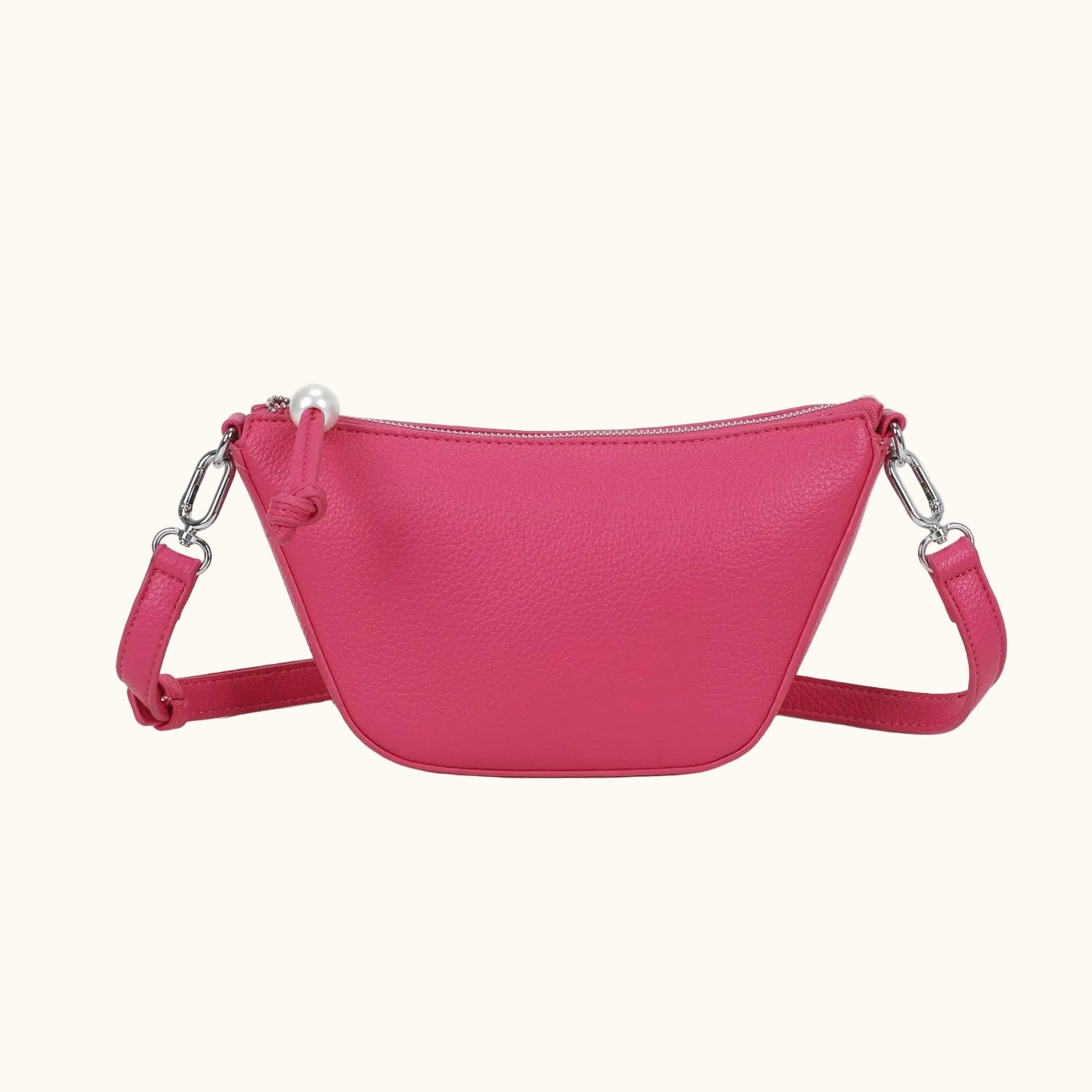 Pink handbag with a strap on a white background