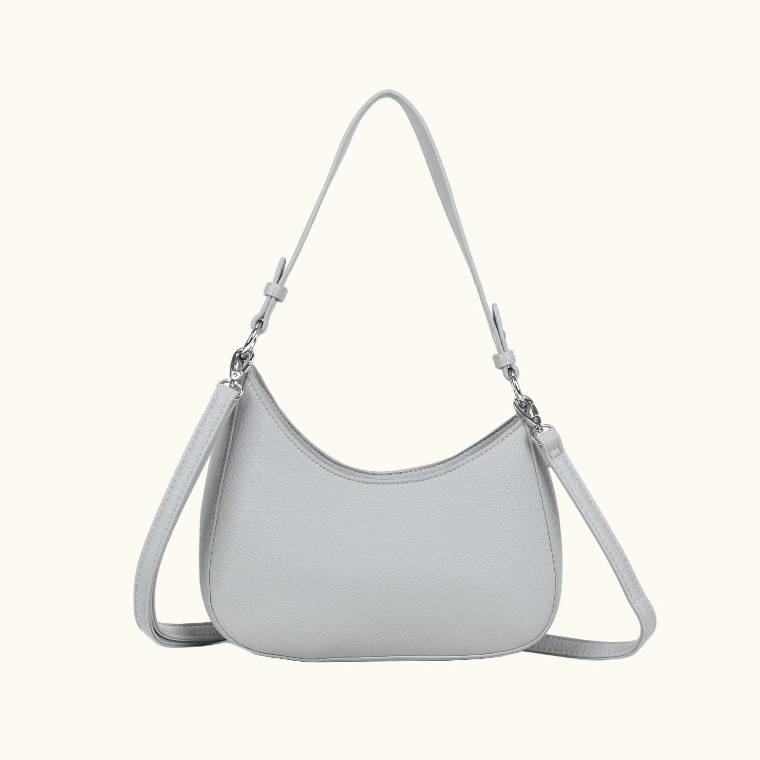Light gray handbag with a strap on a white background