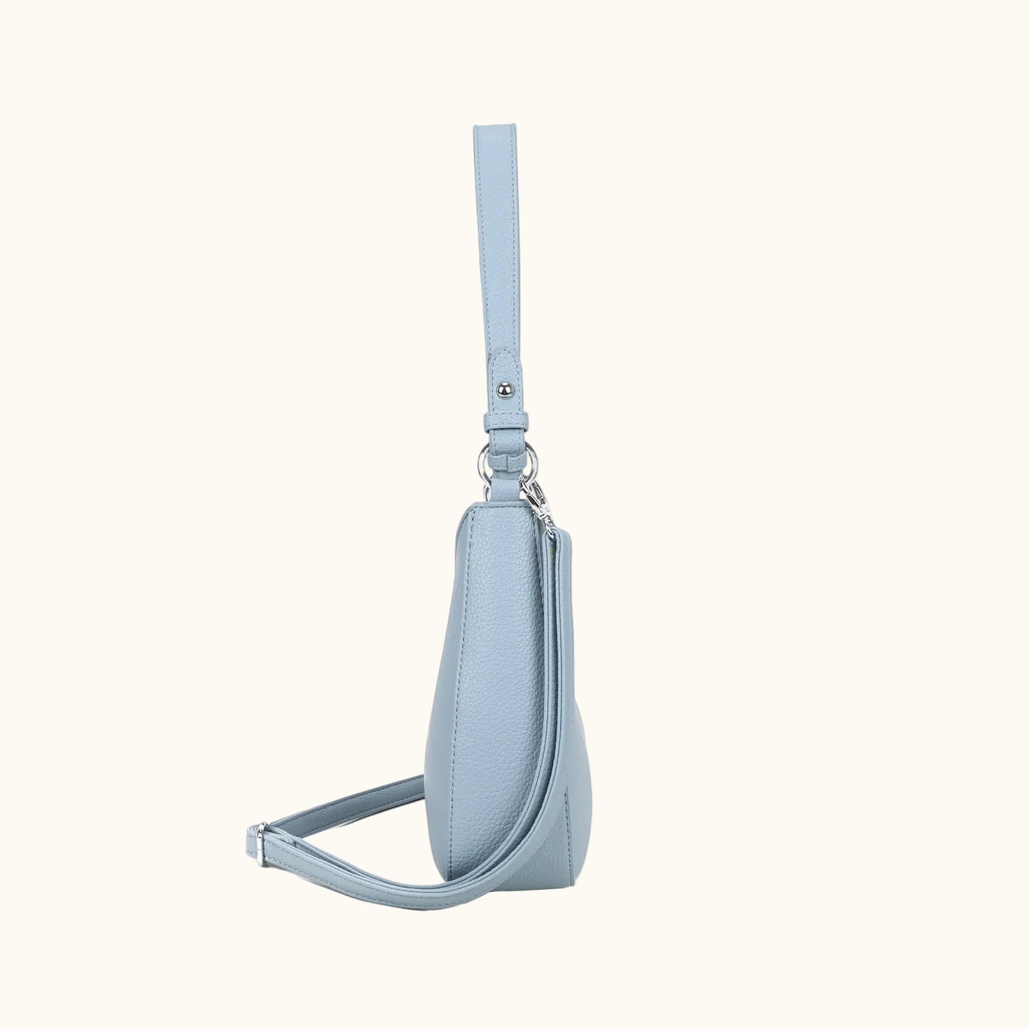 Light blue handbag with a strap on a white background