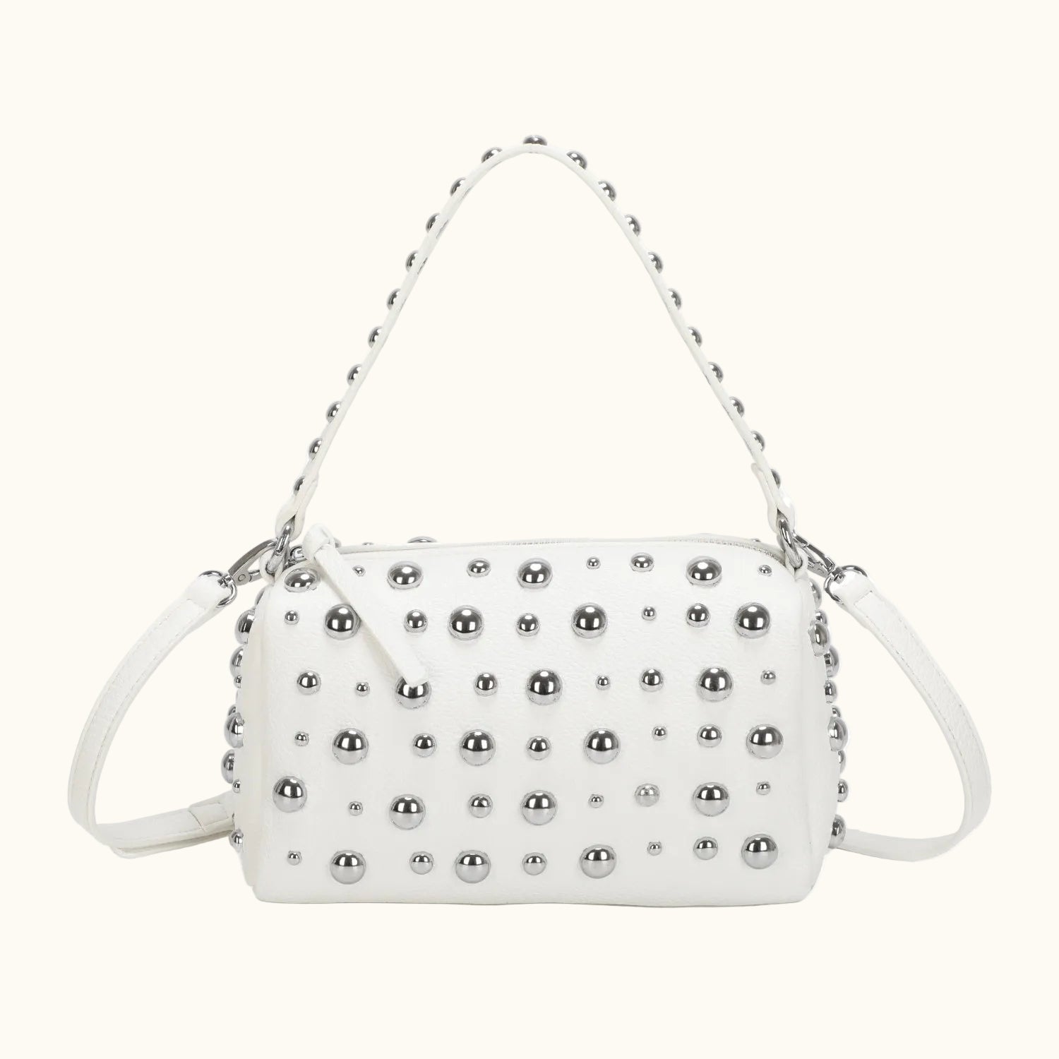White handbag with silver studs on a white background