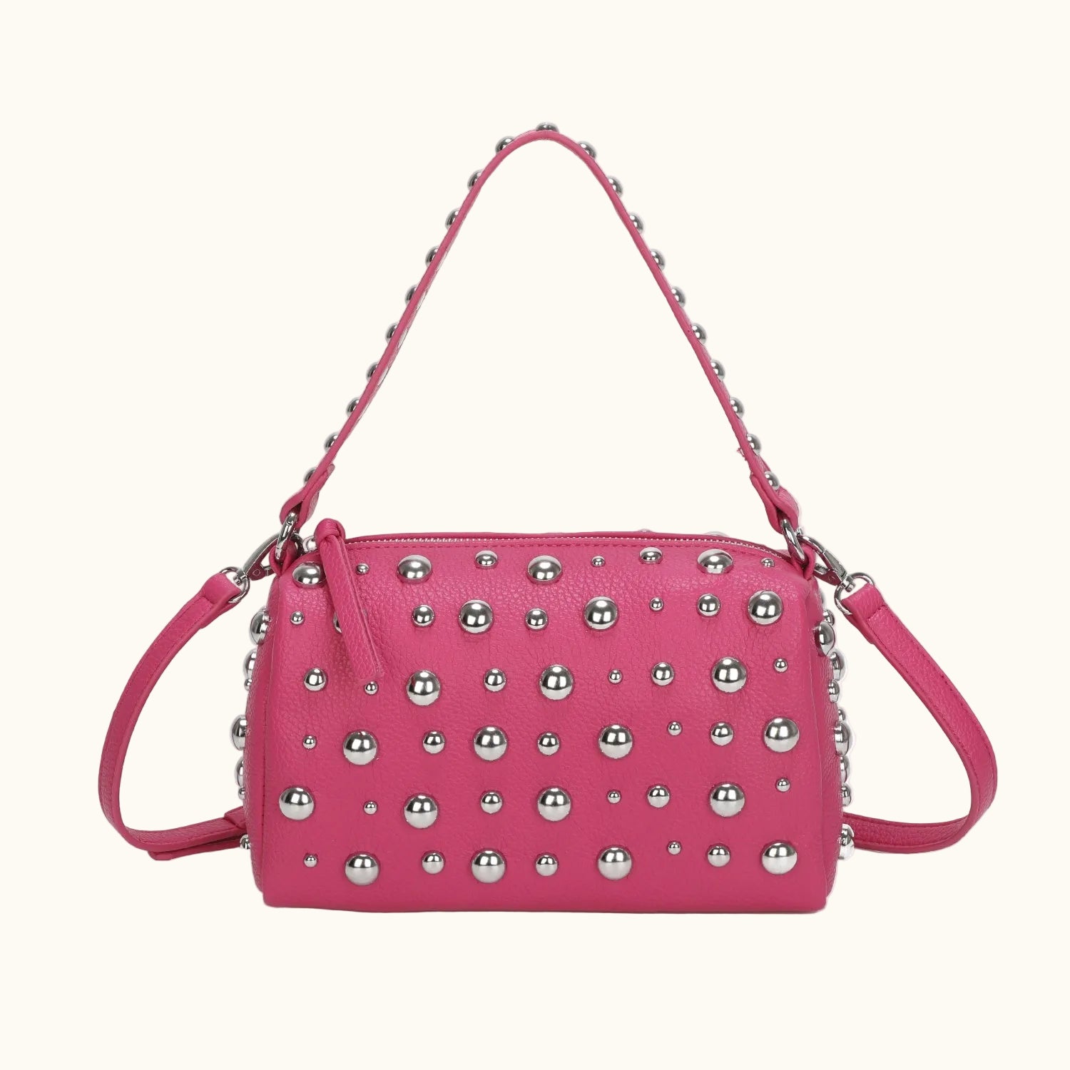 Pink handbag with silver studs on a white background