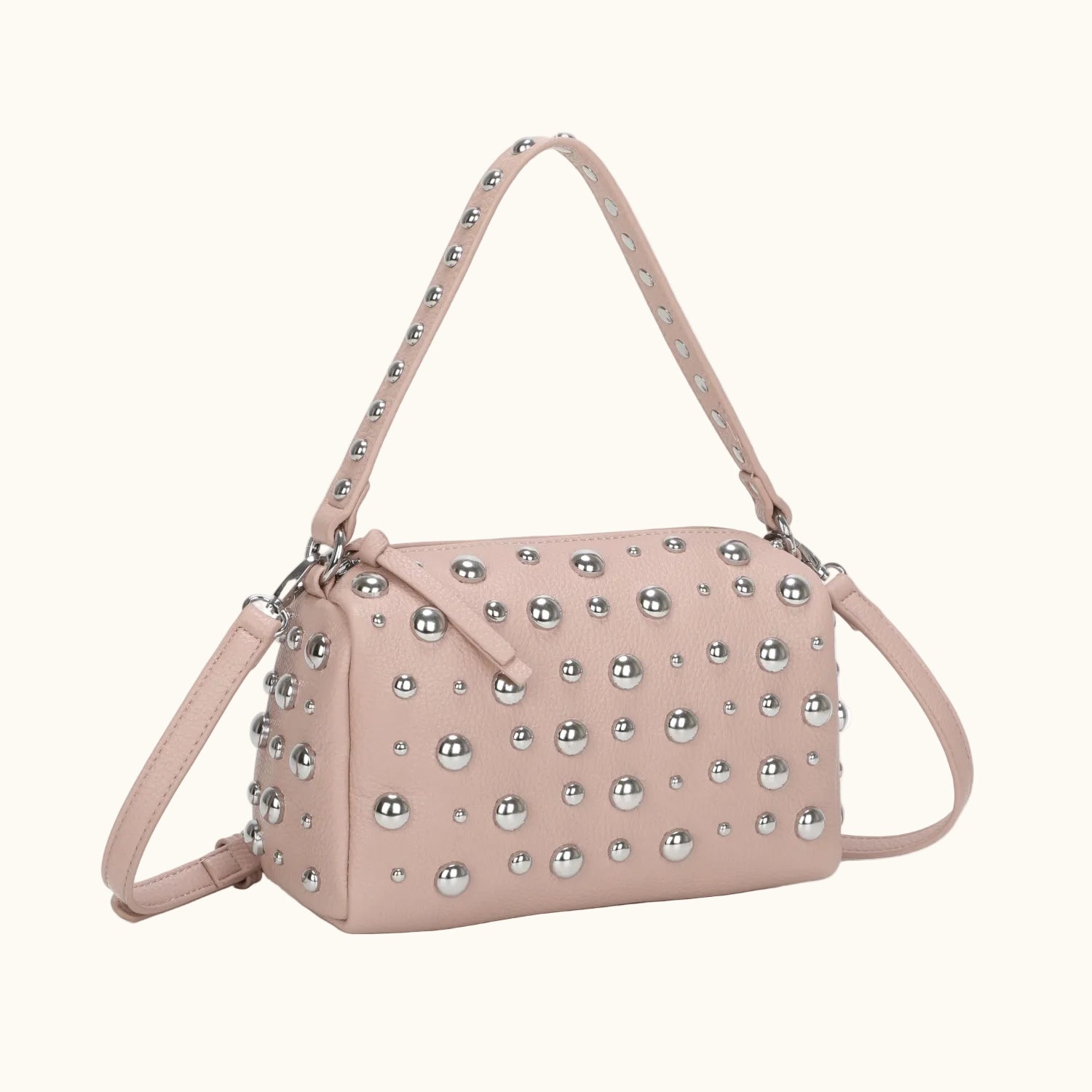 Pink handbag with silver studs on a white background