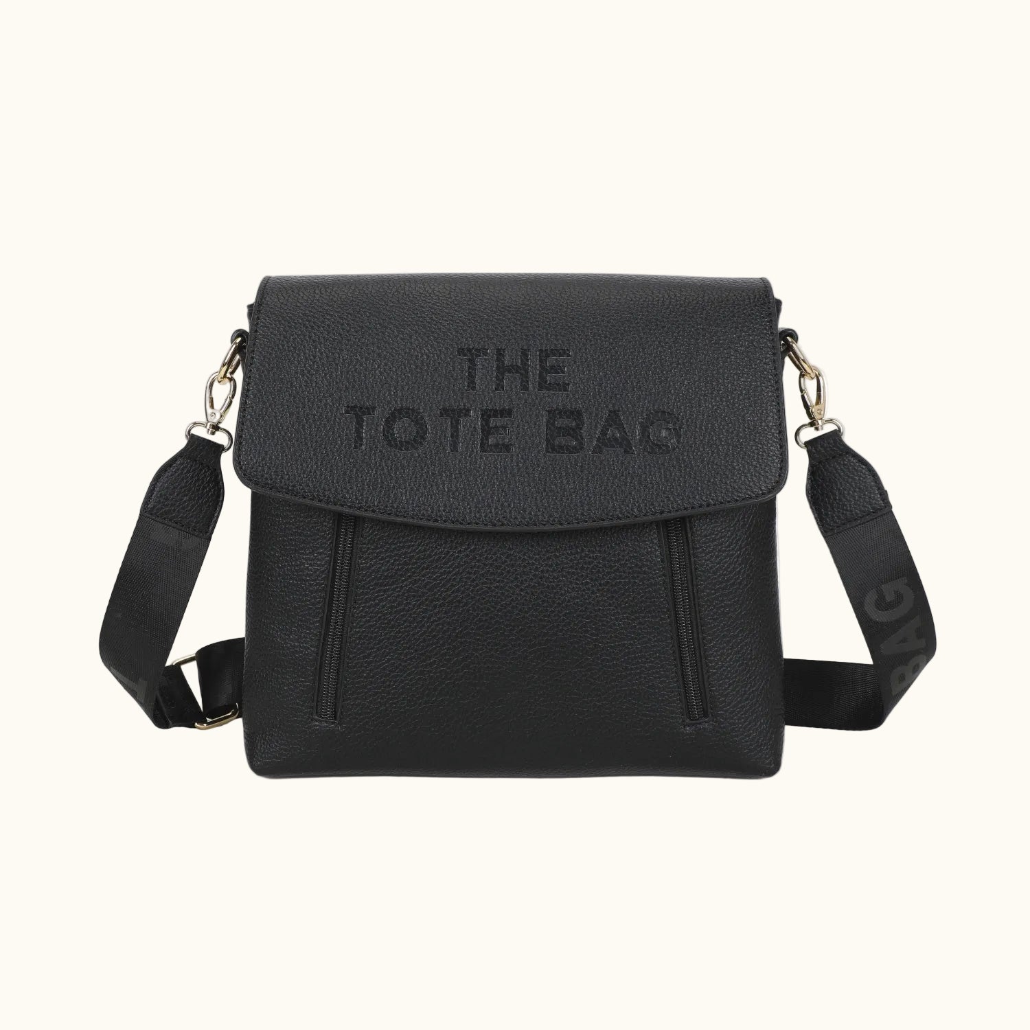 Black tote bag with 'THE TOTE BAG' text on a white background