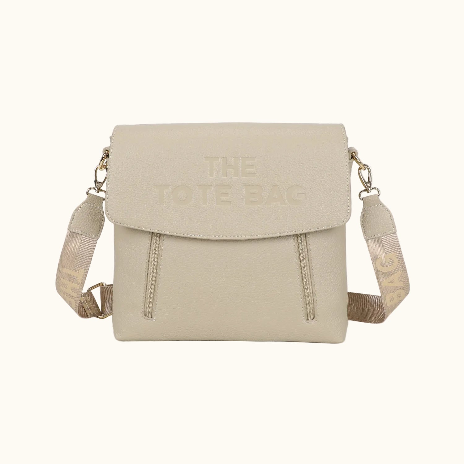 Beige crossbody bag with 'The Tote Bag' text on a white background