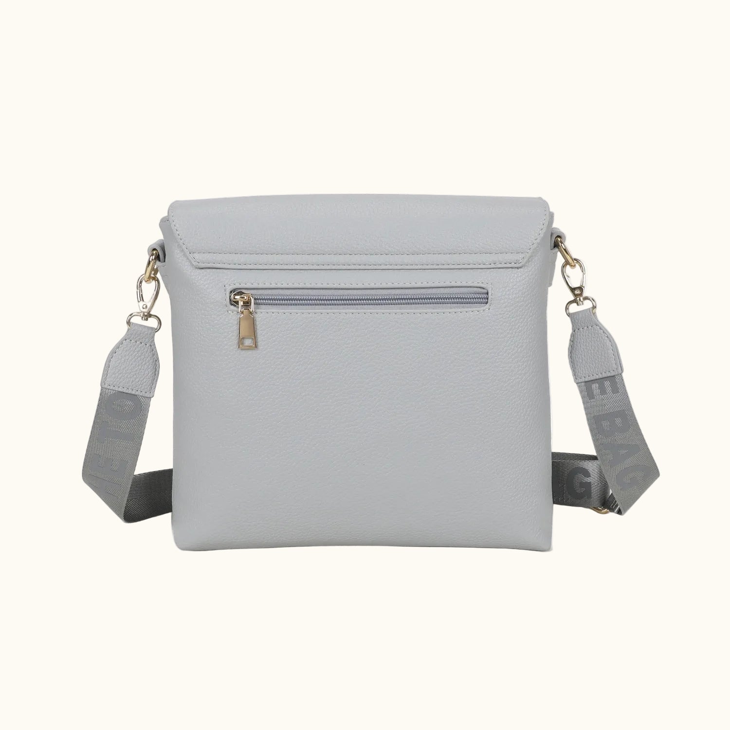 Light gray crossbody bag with a strap on a white background