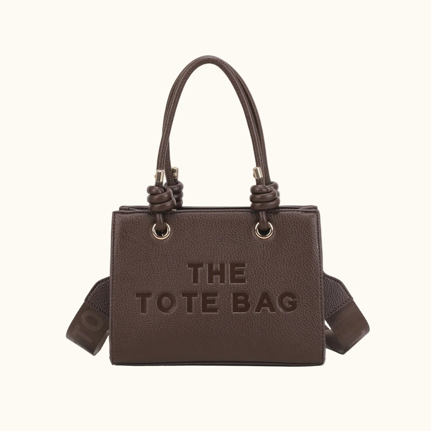 Brown tote bag with 'THE TOTE BAG' text on a white background