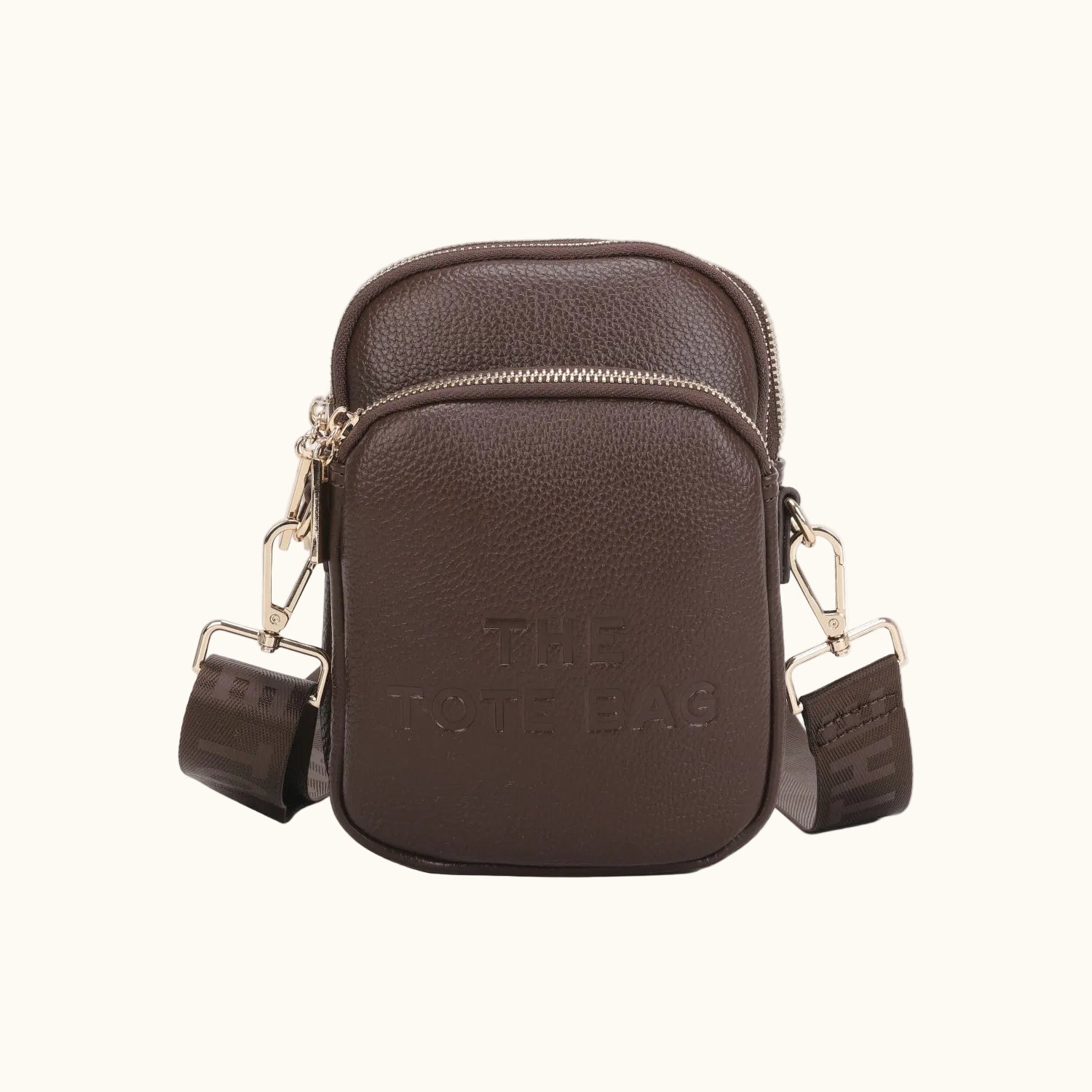 Brown leather crossbody bag with gold accents on a white background