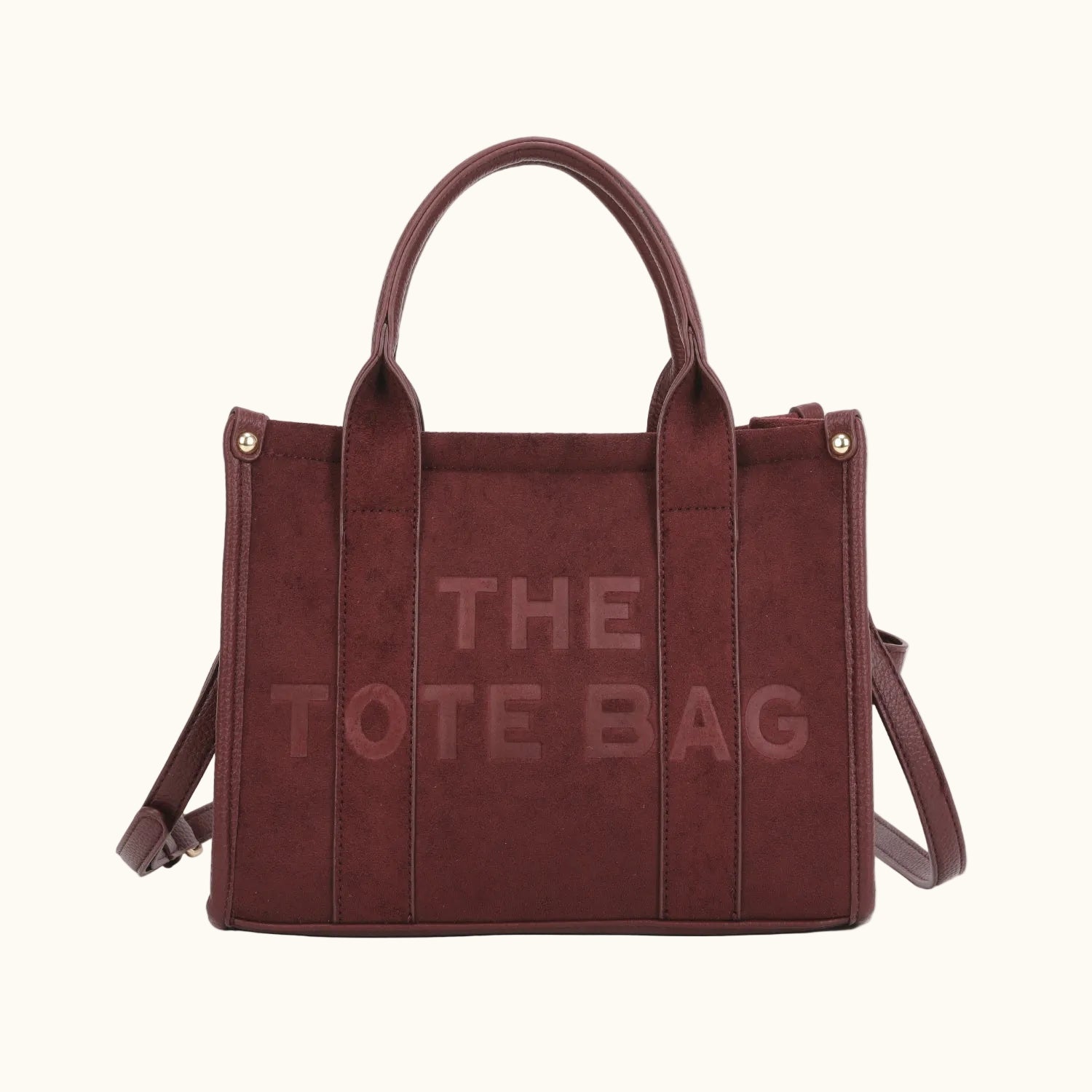 Brown tote bag with 'THE TOTE BAG' text on a white background