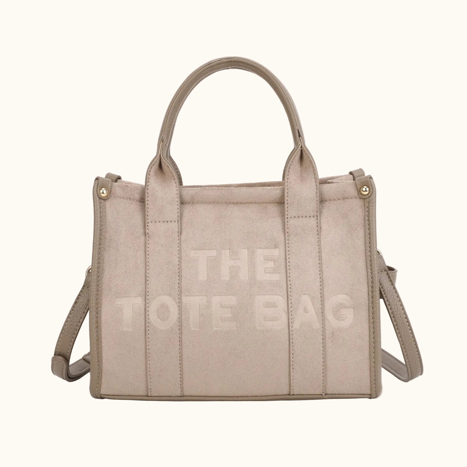 Beige tote bag with 'THE TOTE BAG' text on a white background